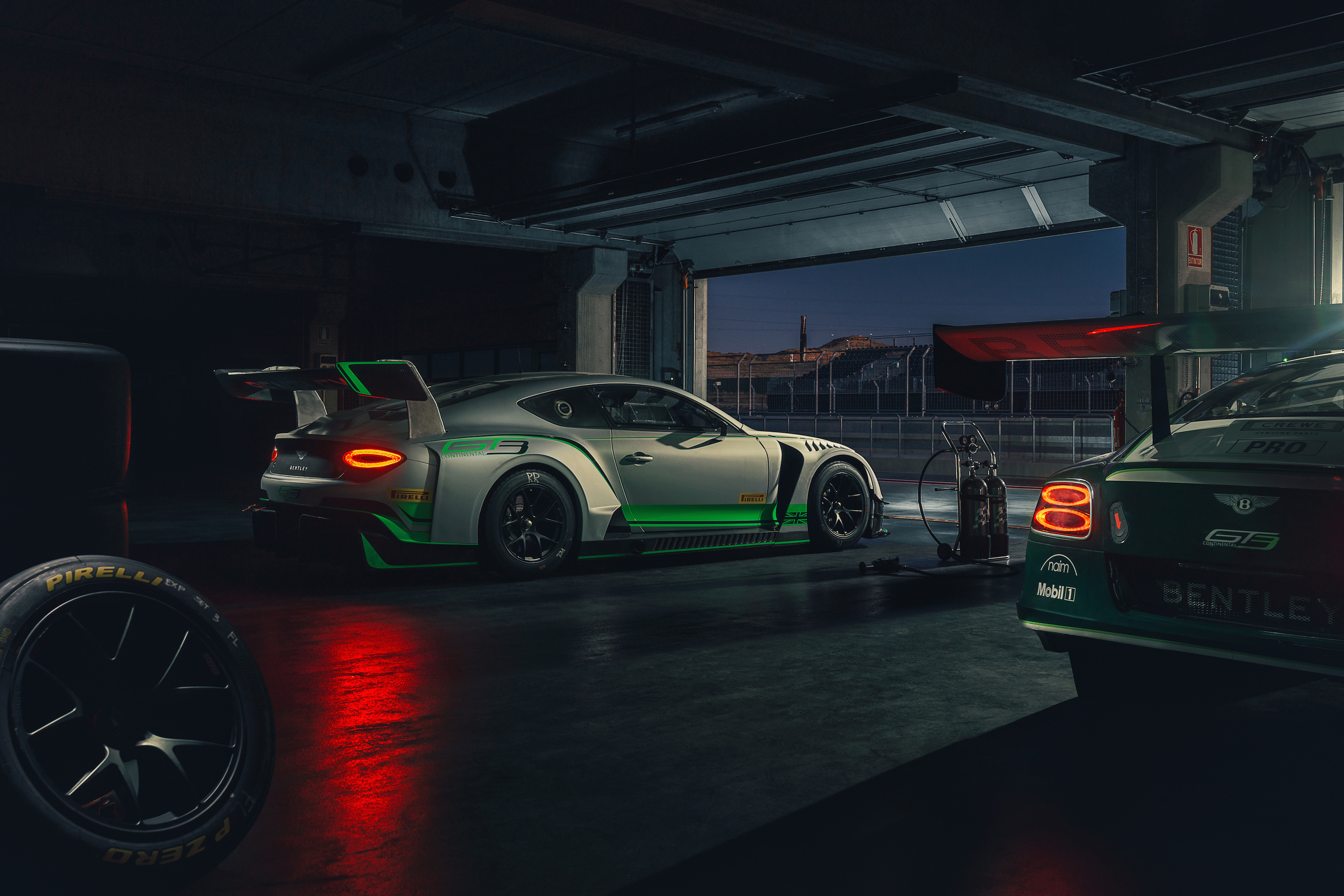 Bentley Continental GT3 race cars in a garage HD Wallpaper