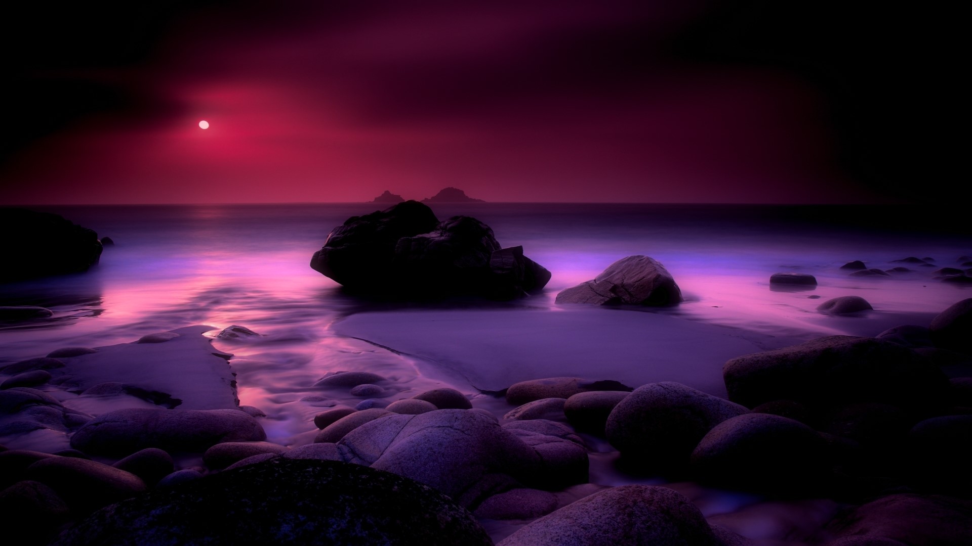 Purple sunset over rocky beach HD Wallpaper