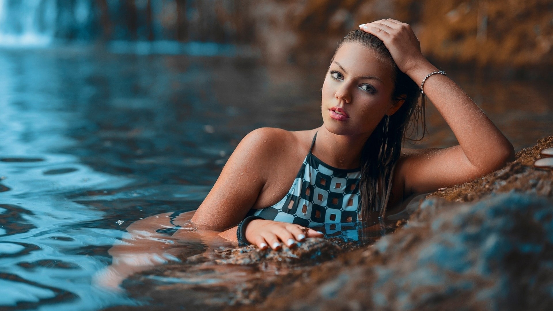 Girl in a patterned swimsuit in water HD Wallpaper