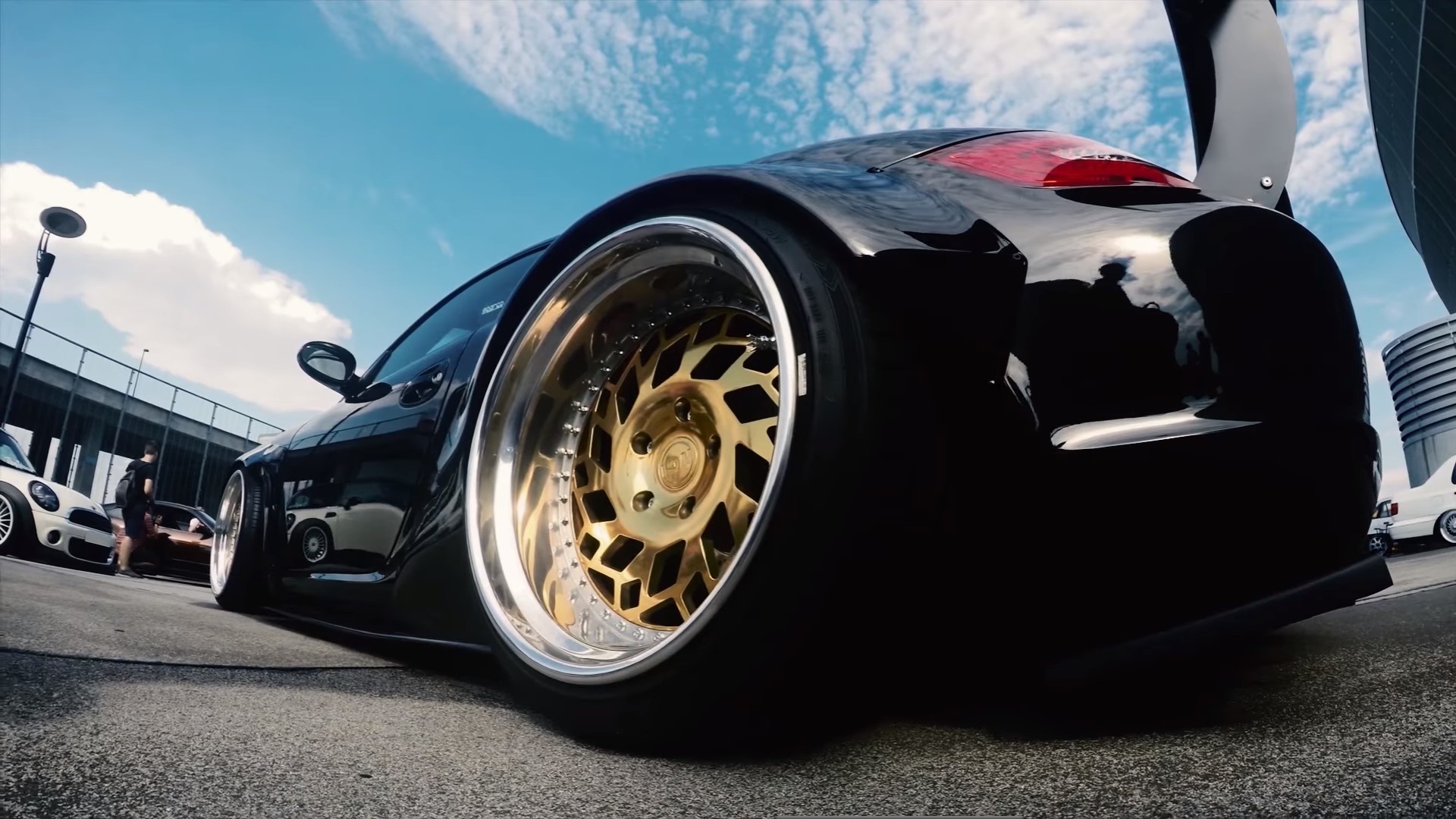 Black sports car with gold rims HD Wallpaper