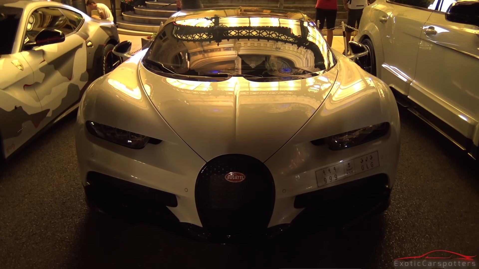 Bugatti Chiron parked next to other luxury cars HD Wallpaper