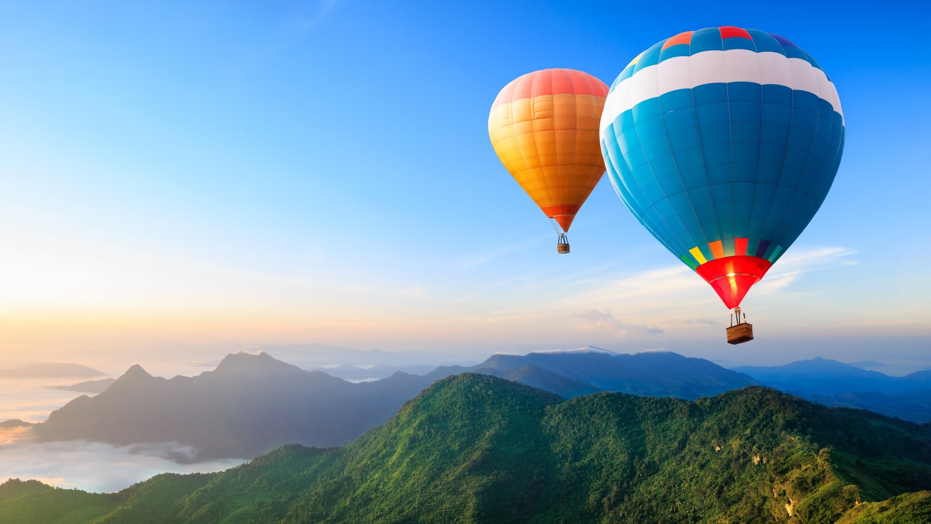 Hot air balloons over mountains at sunrise HD Wallpaper