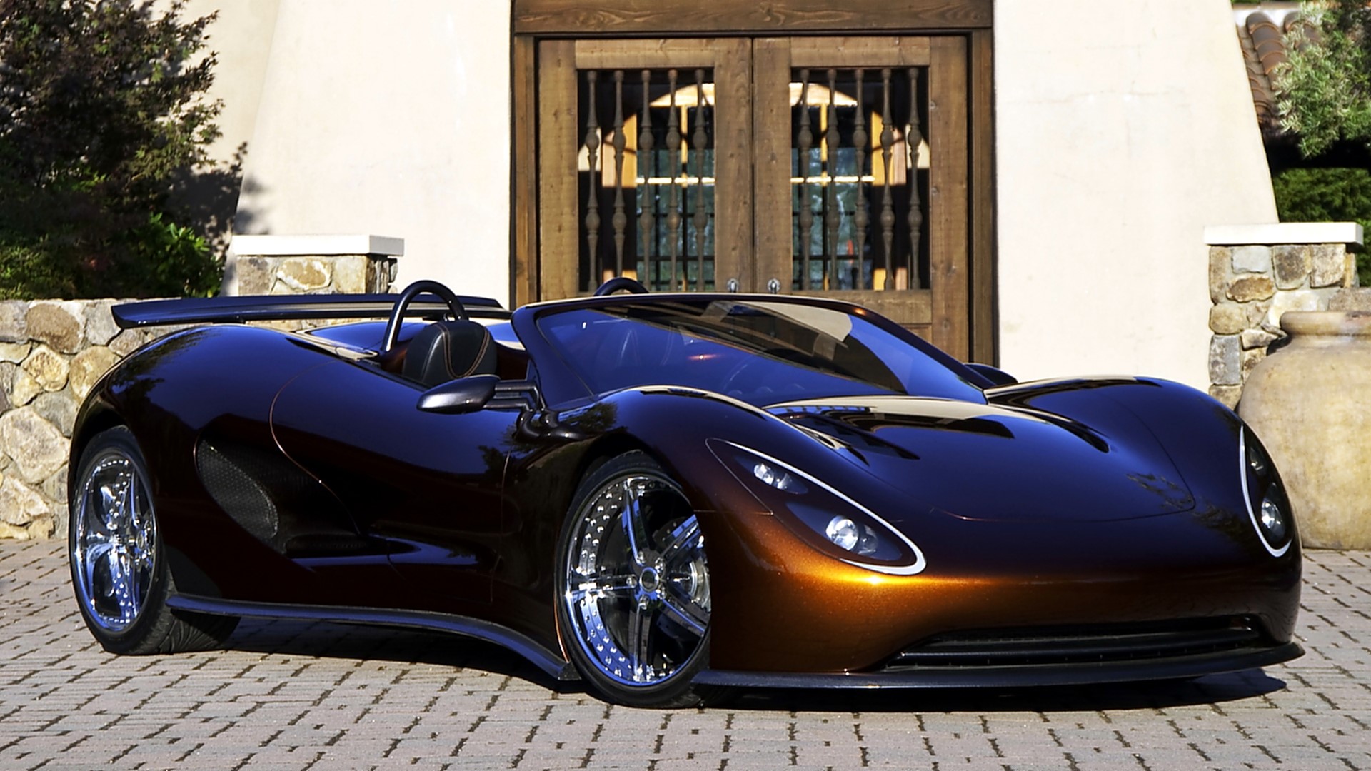 Brown convertible sports car parked in front of a building HD Wallpaper