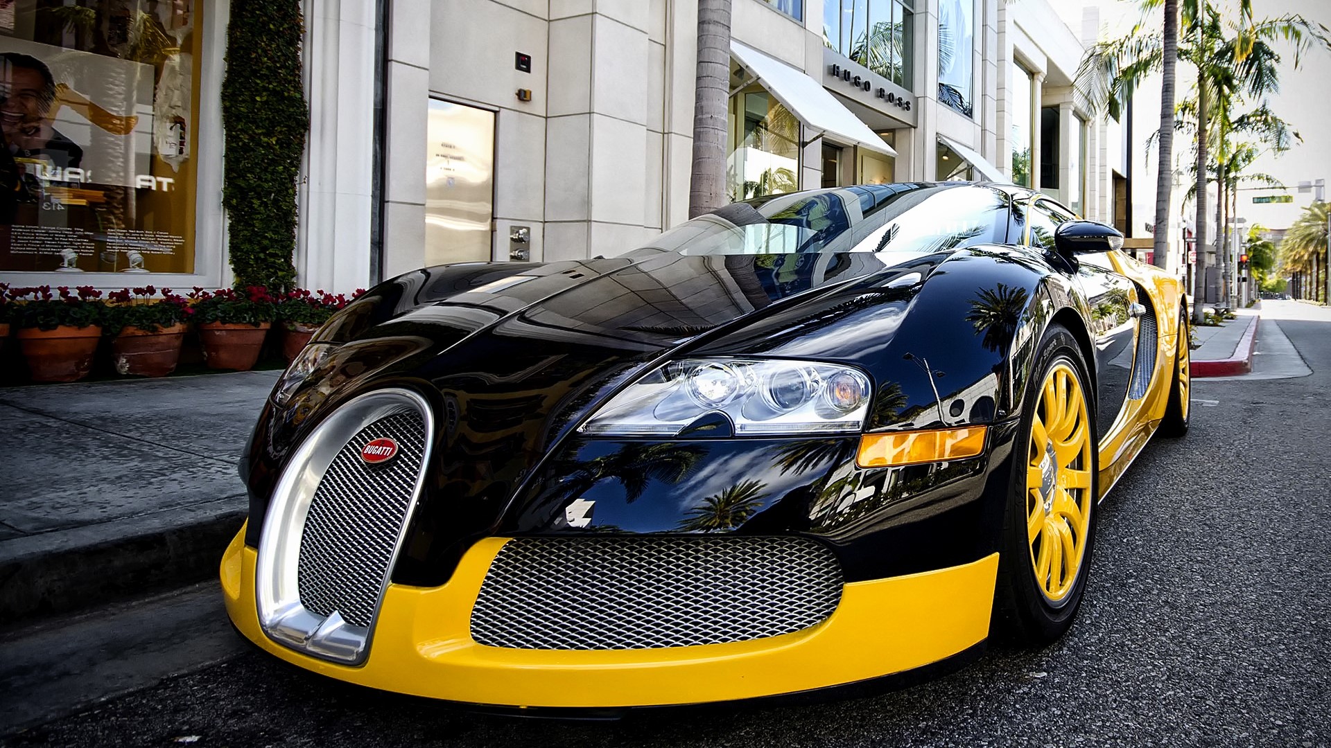 Black and yellow Bugatti Veyron parked on street HD Wallpaper