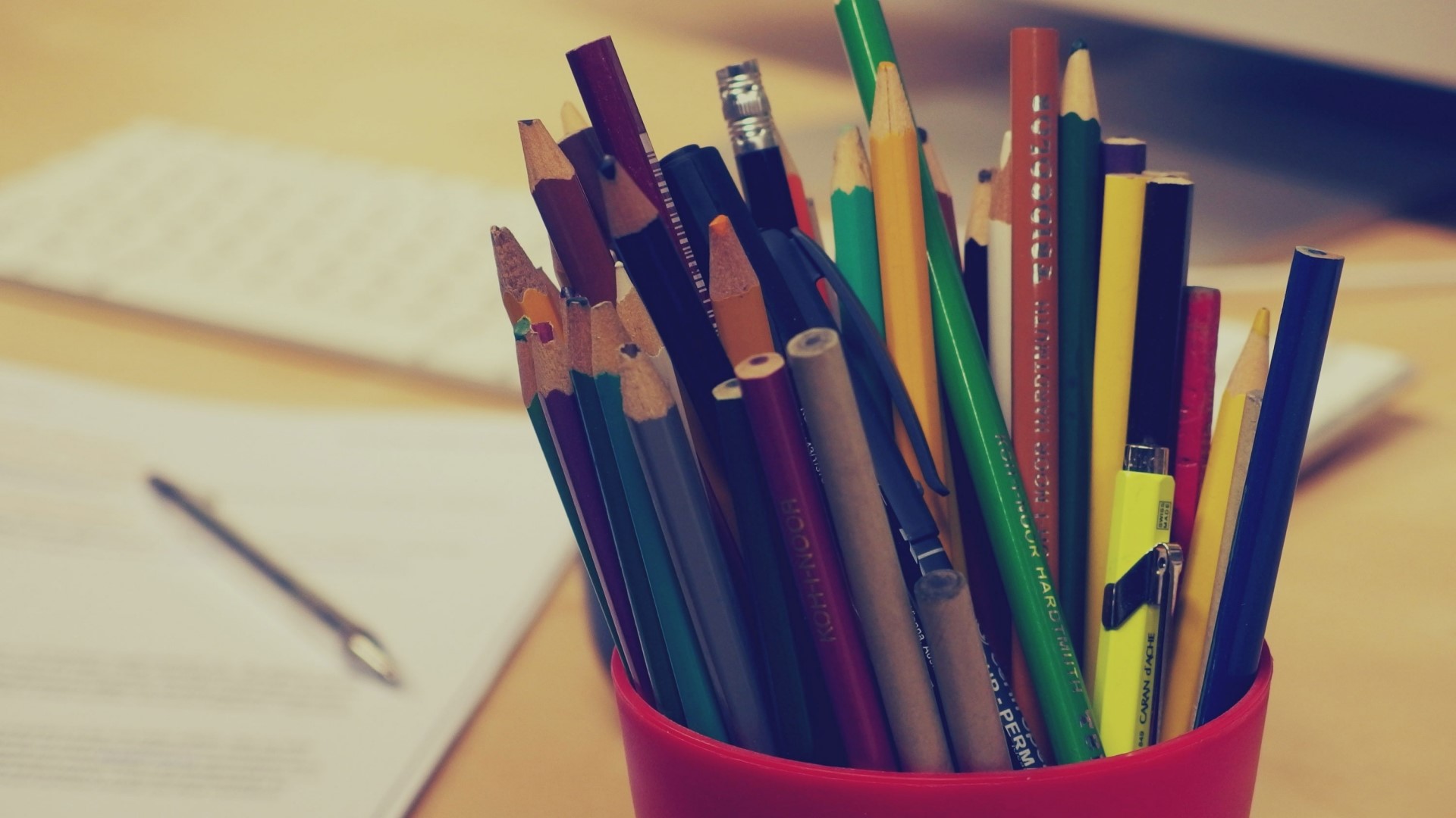 Pencils in a red cup on a desk HD Wallpaper