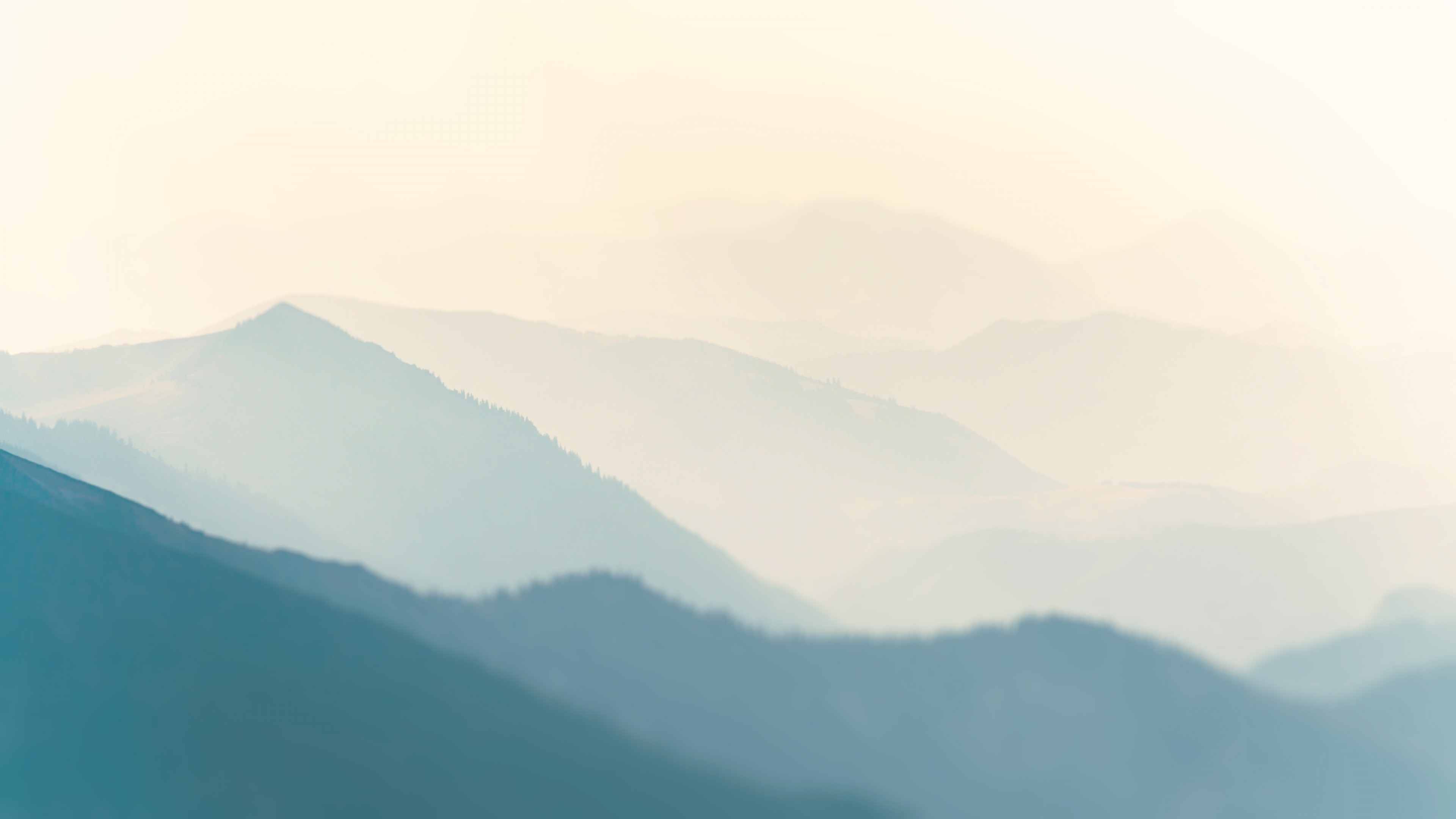 Mountain peaks in fog HD Wallpaper