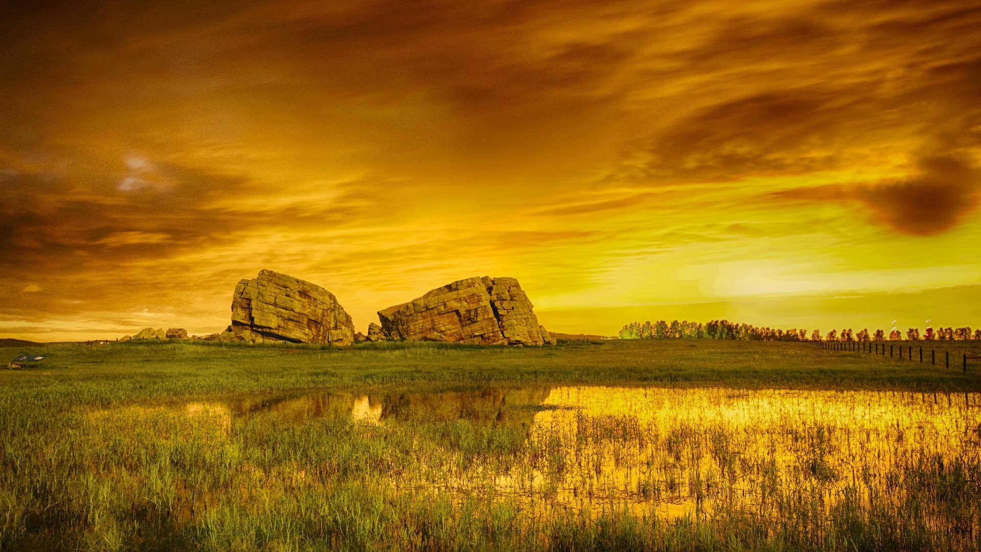 Golden Sunset Over Rocky Landscape HD Wallpaper