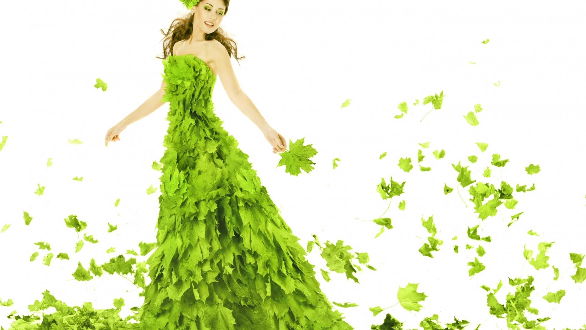 Woman in a dress made of green leaves HD Wallpaper
