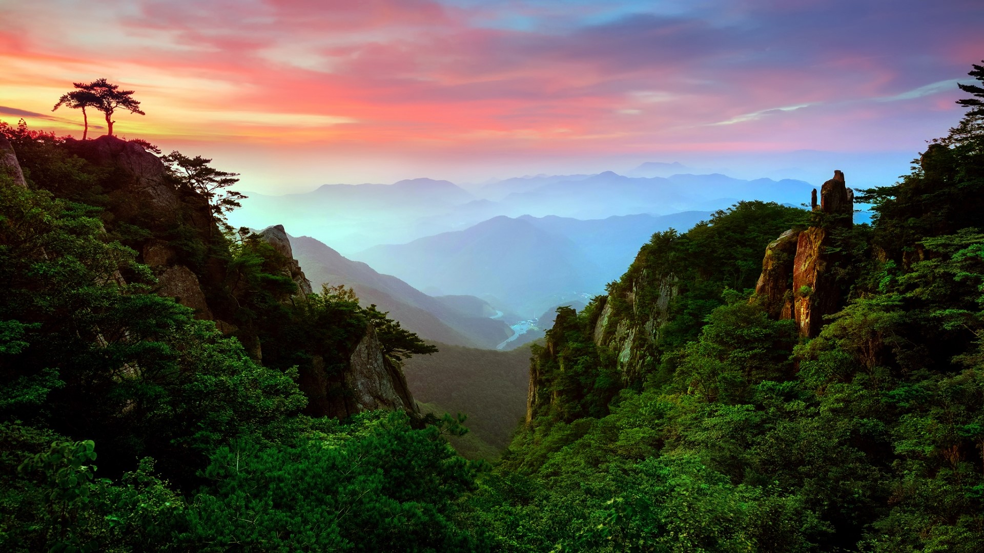 Mountain valley at sunrise with colorful sky HD Wallpaper
