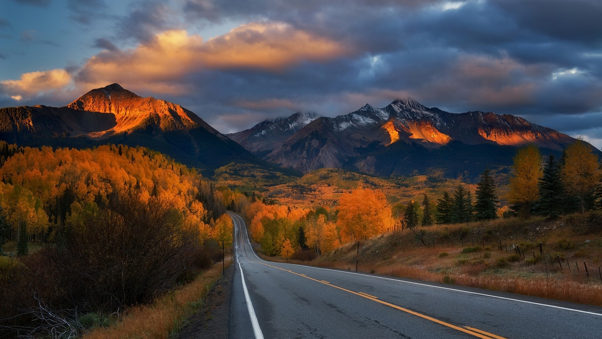 Mountain road during autumn sunset HD Wallpaper