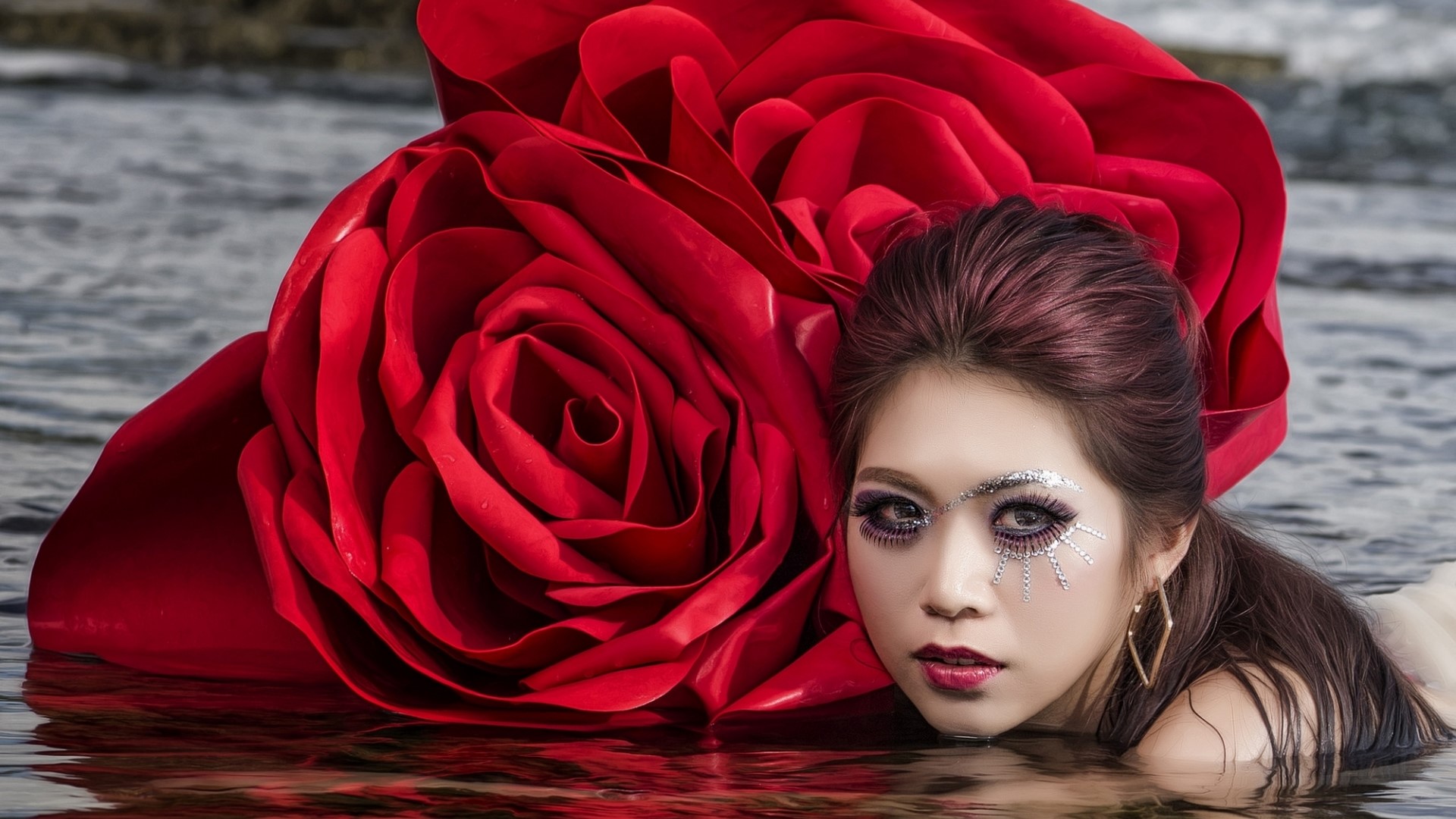 Woman with large red rose in water HD Wallpaper