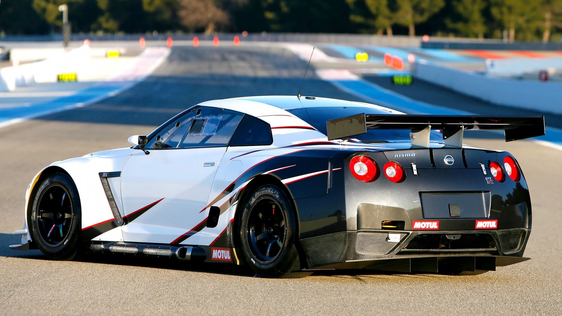 Nissan GT-R Nismo race car on a track HD Wallpaper
