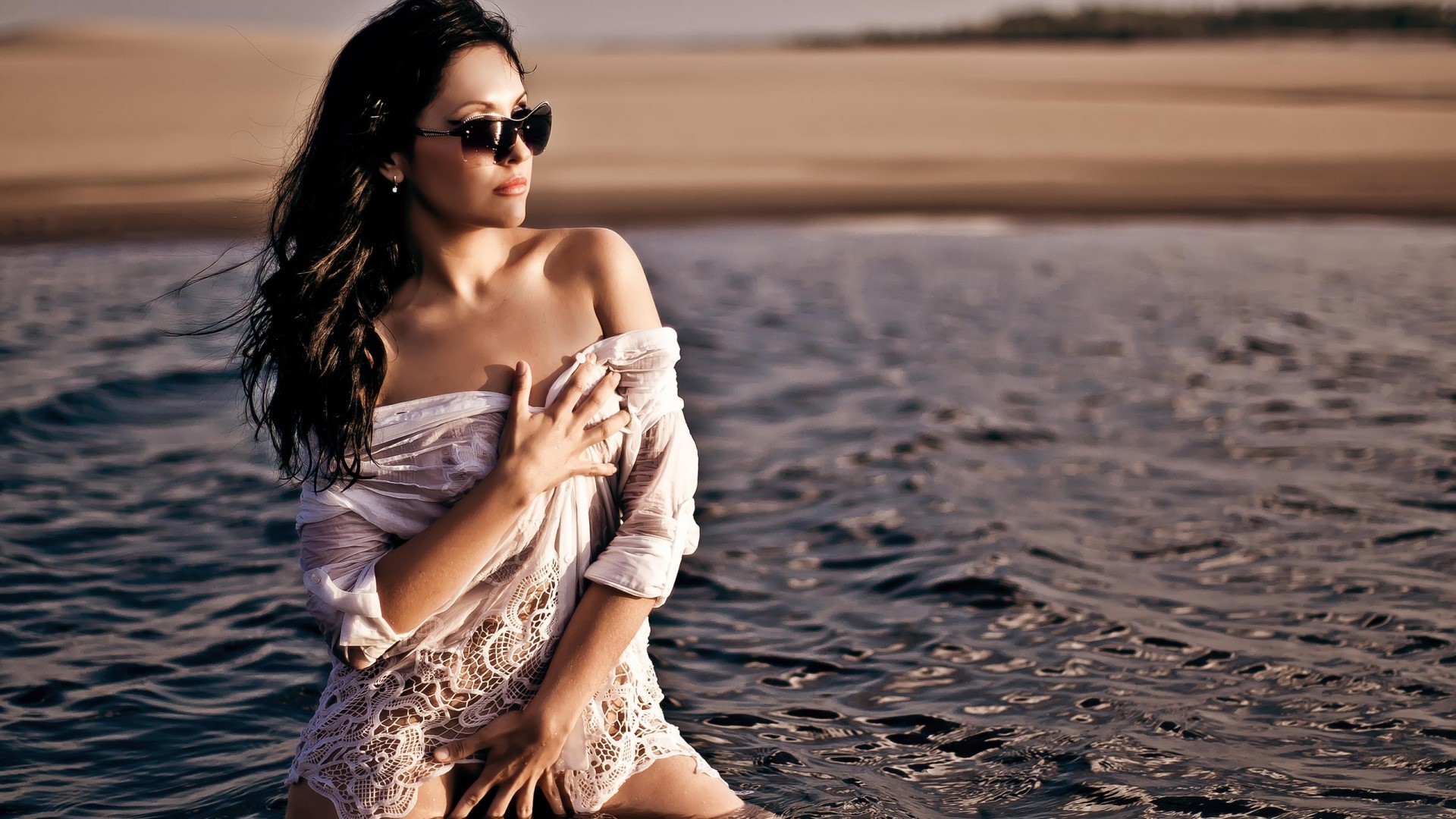 Woman in sunglasses and wet white shirt in the water HD Wallpaper
