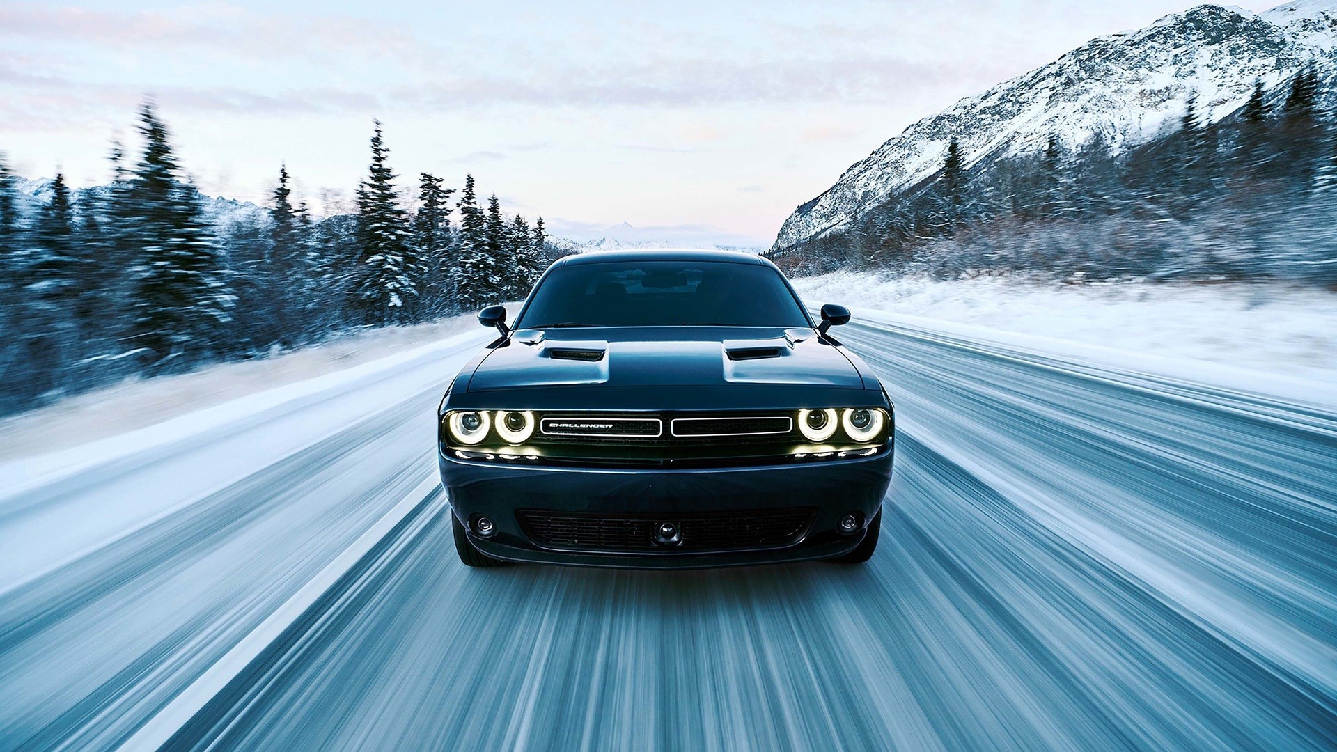 Dodge Challenger GT AWD driving on a snowy road HD Wallpaper