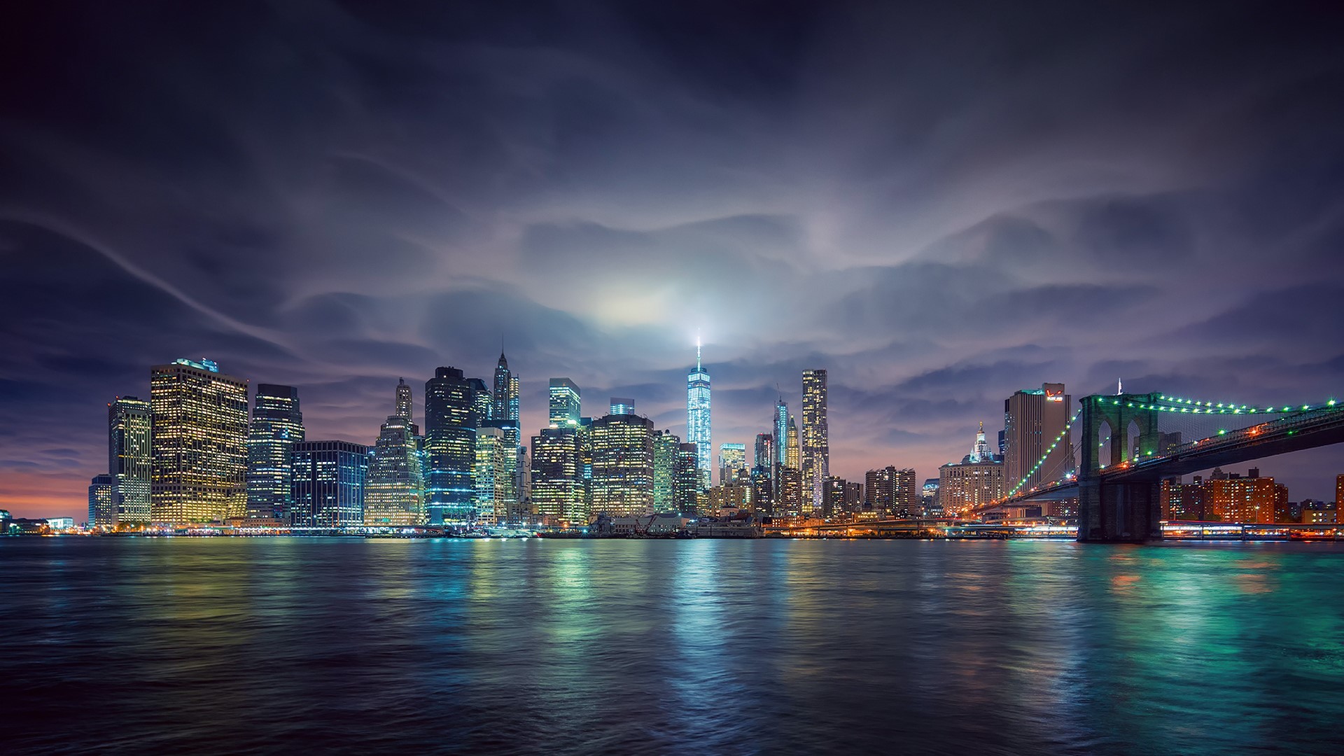 New York City Skyline and Brooklyn Bridge at Night HD Wallpaper