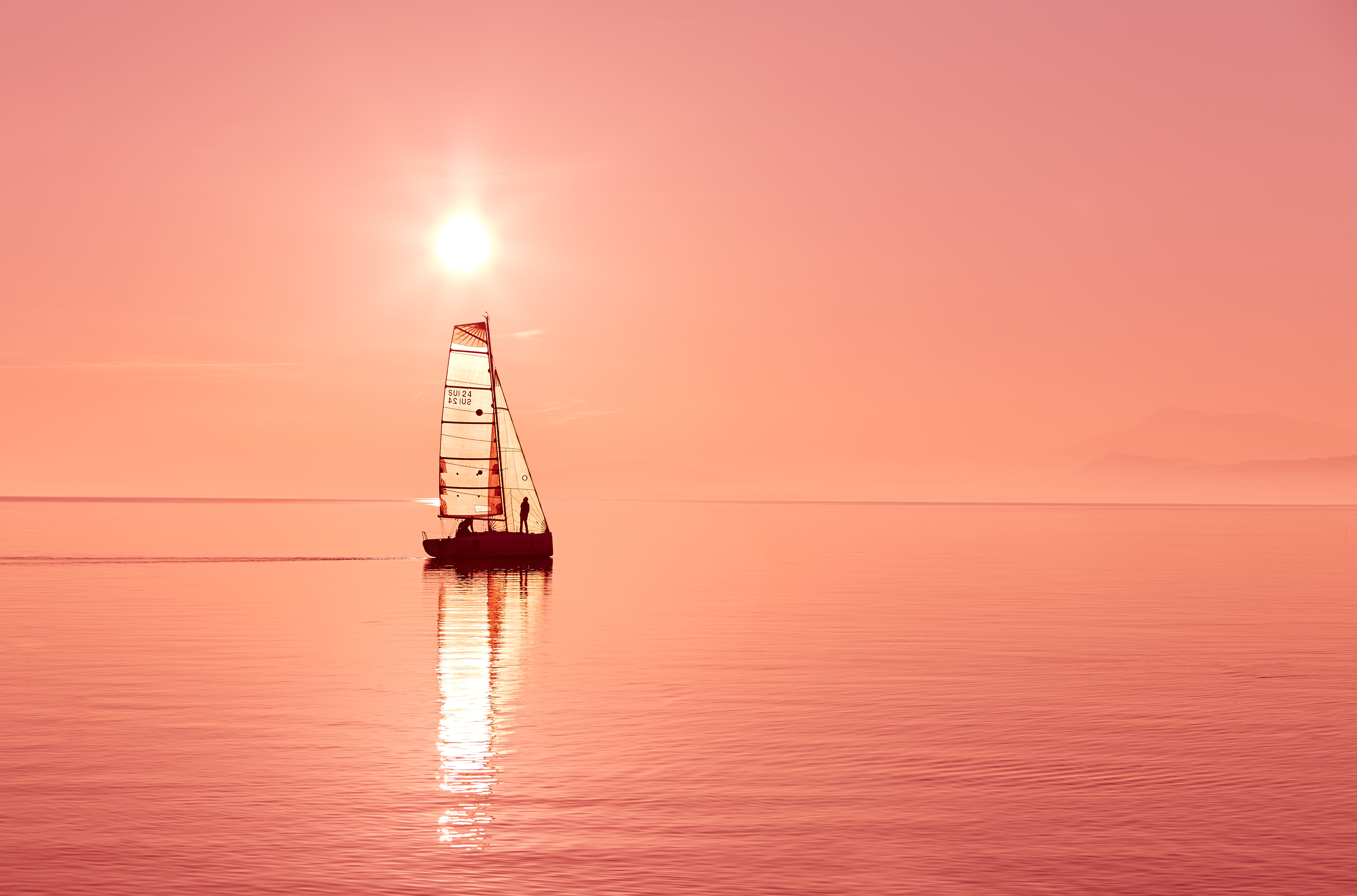 Sailboat on the ocean at sunset 4K HD Wallpaper