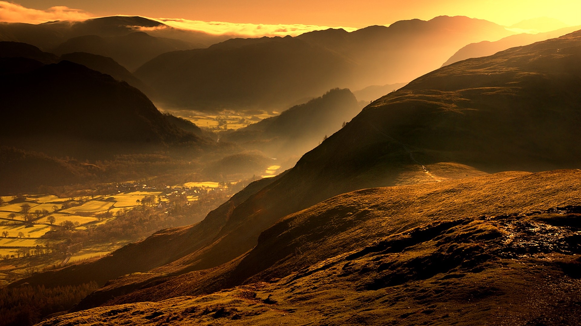 Mountains with fog at sunset HD Wallpaper