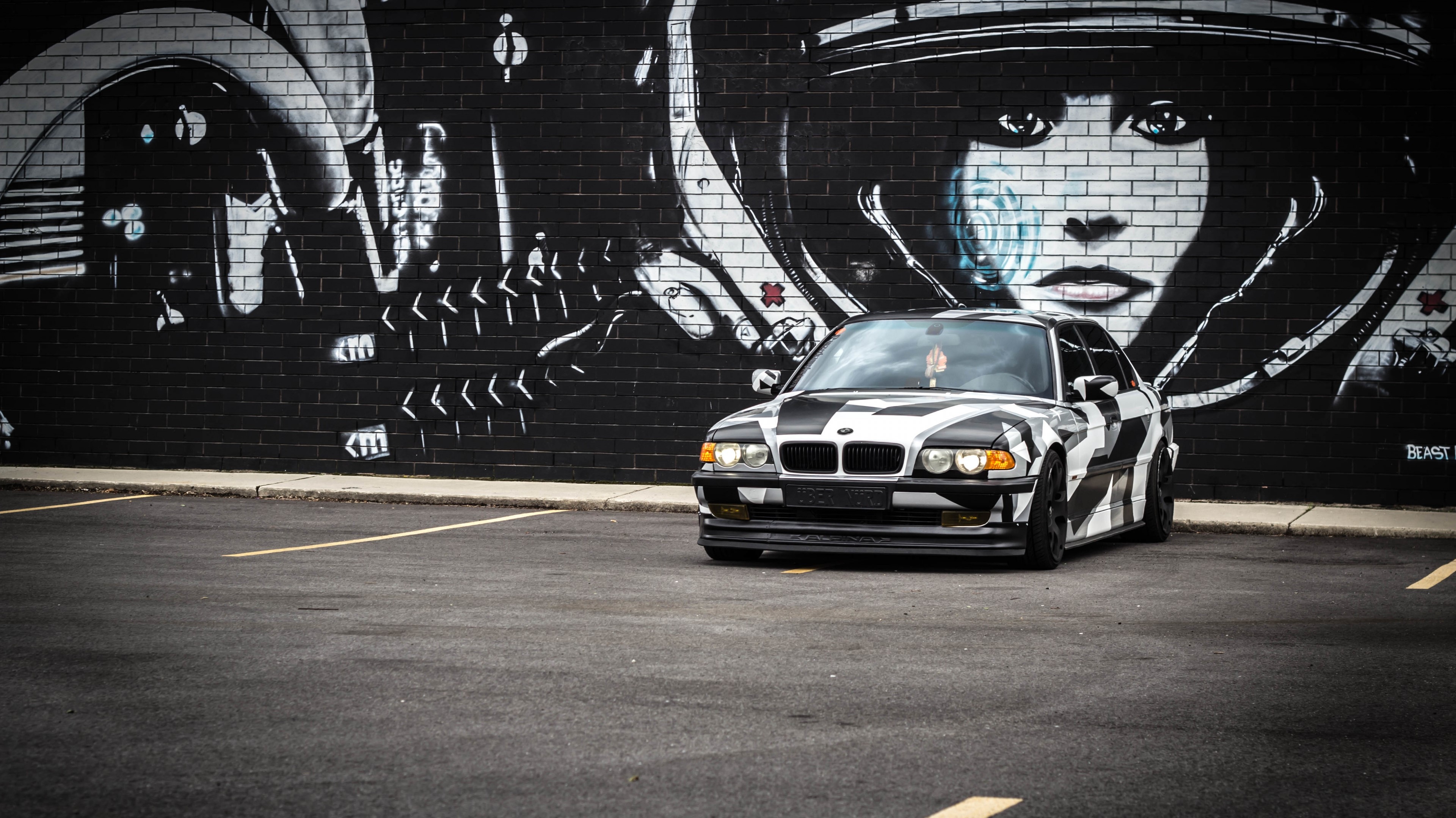 4K BMW with Camouflage Wrap in Front of Graffiti Wall HD Wallpaper
