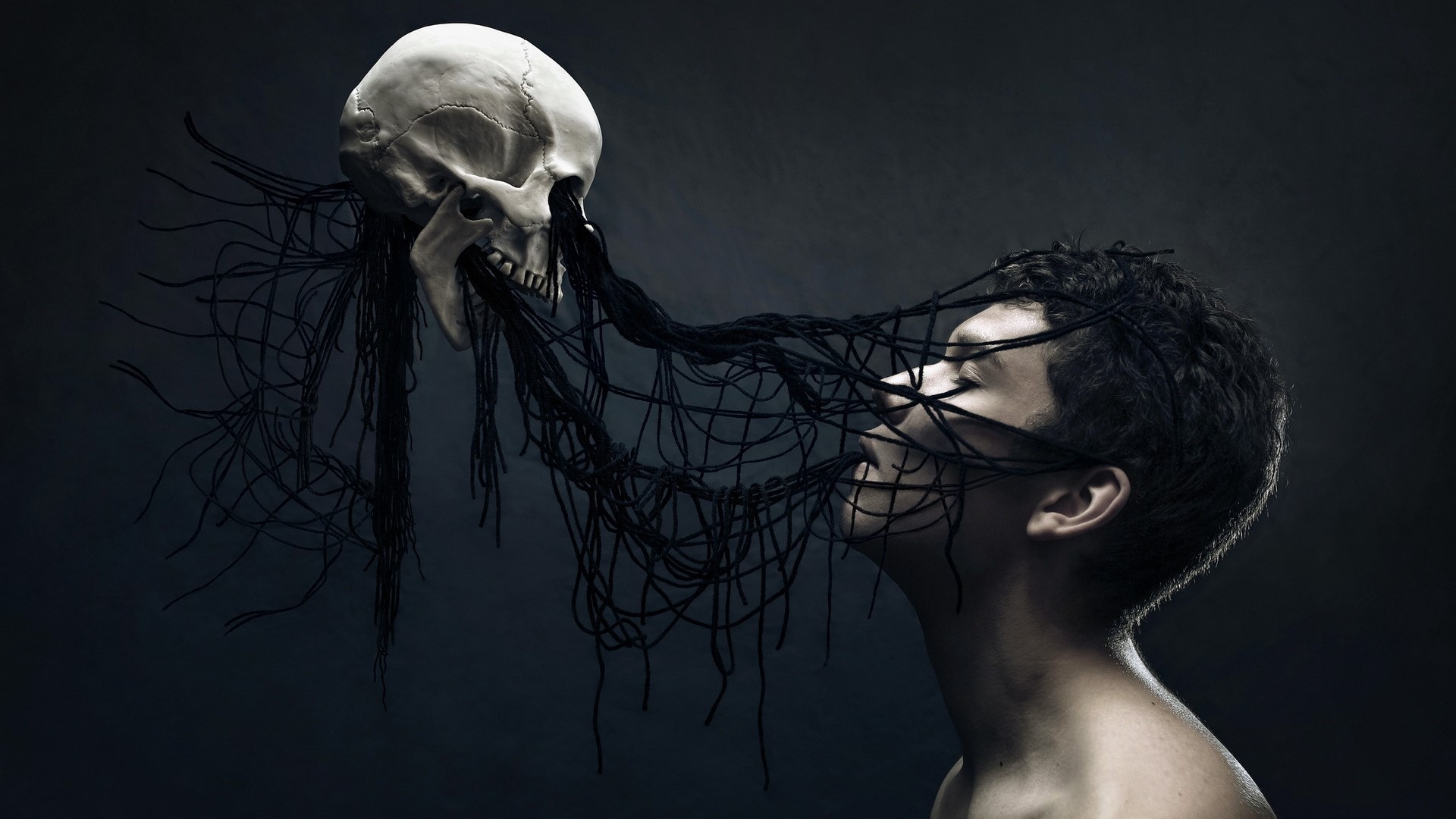 Skull and person entangled in dark threads HD Wallpaper