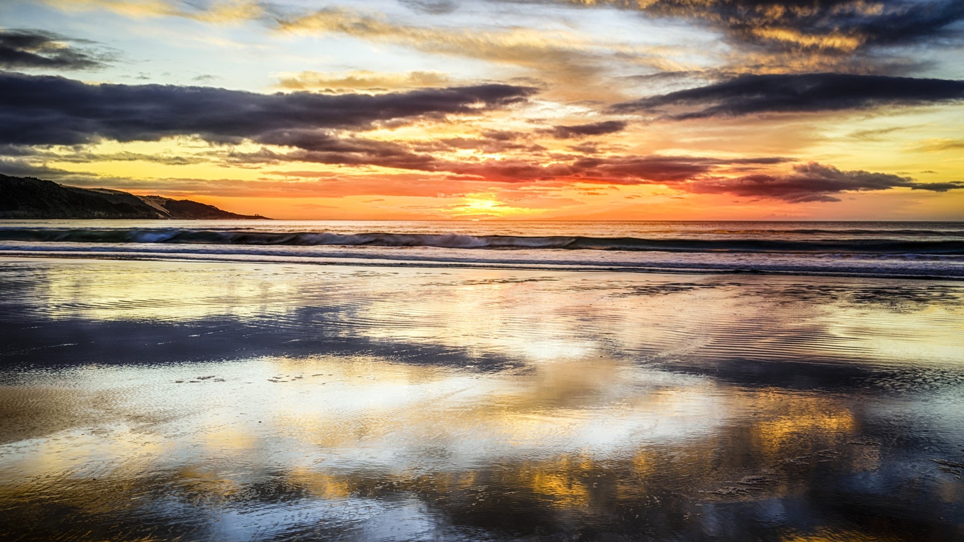 Sunset over a beach with reflections HD Wallpaper