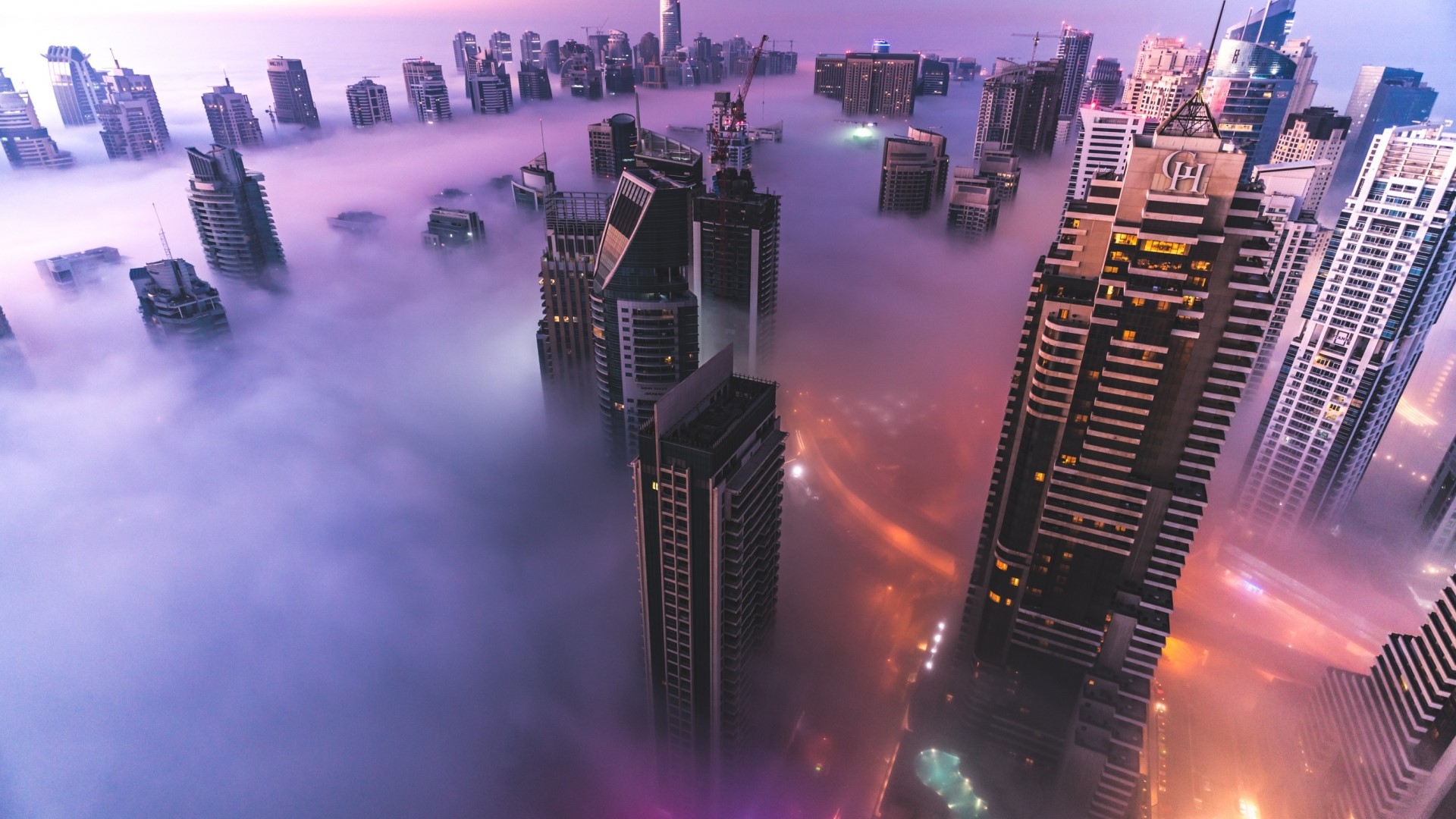 Dubai skyscrapers shrouded in fog at sunrise HD Wallpaper