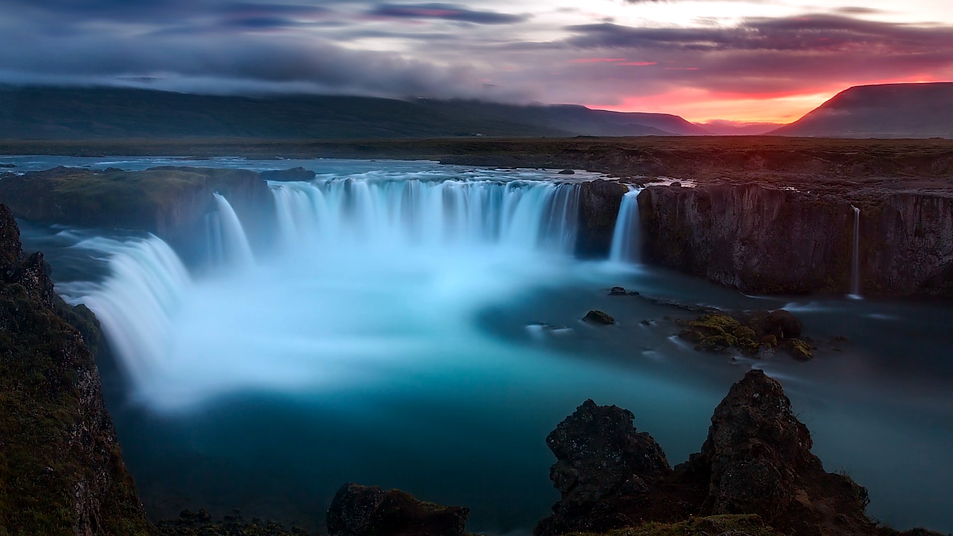 Waterfall at sunset with colorful sky HD Wallpaper