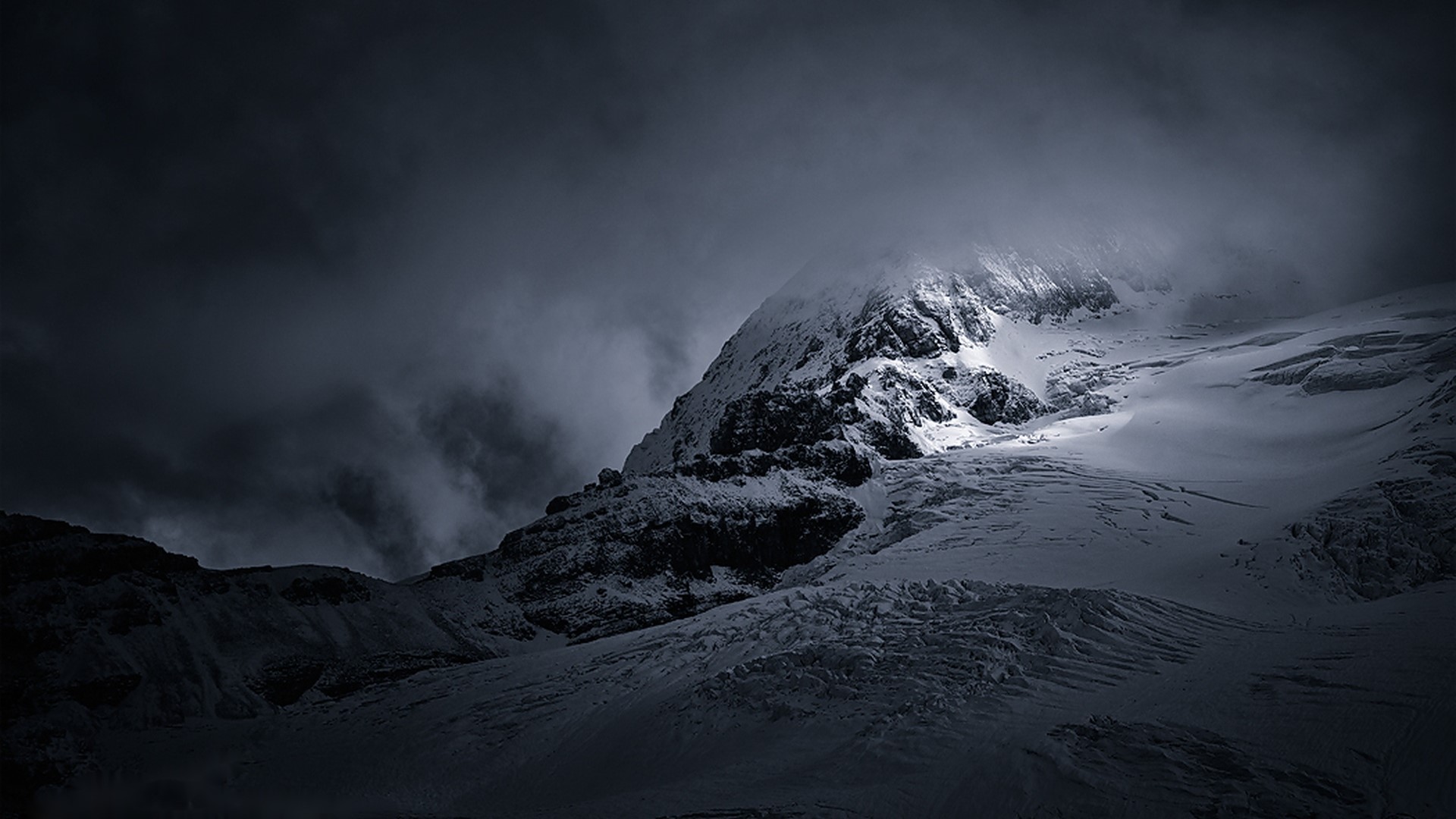 Snowy mountains under dark clouds HD Wallpaper