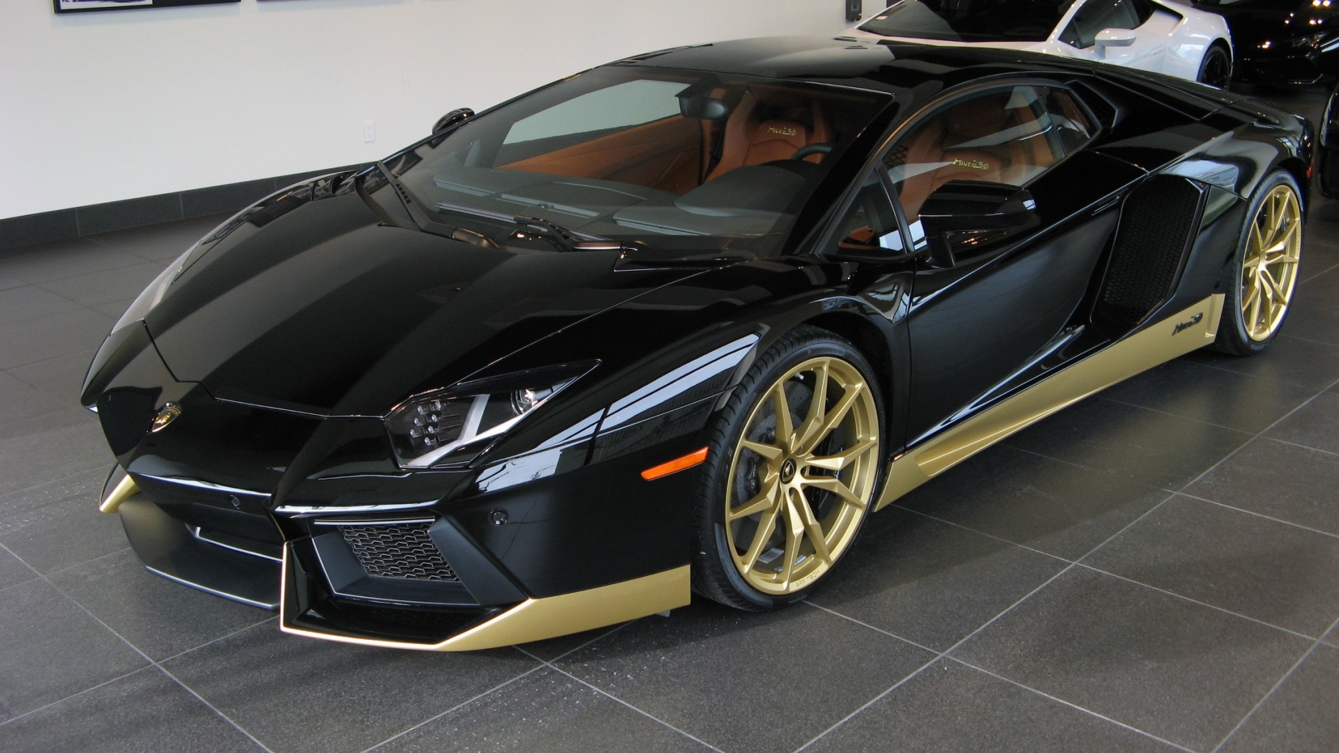 Black Lamborghini Aventador with gold accents HD Wallpaper
