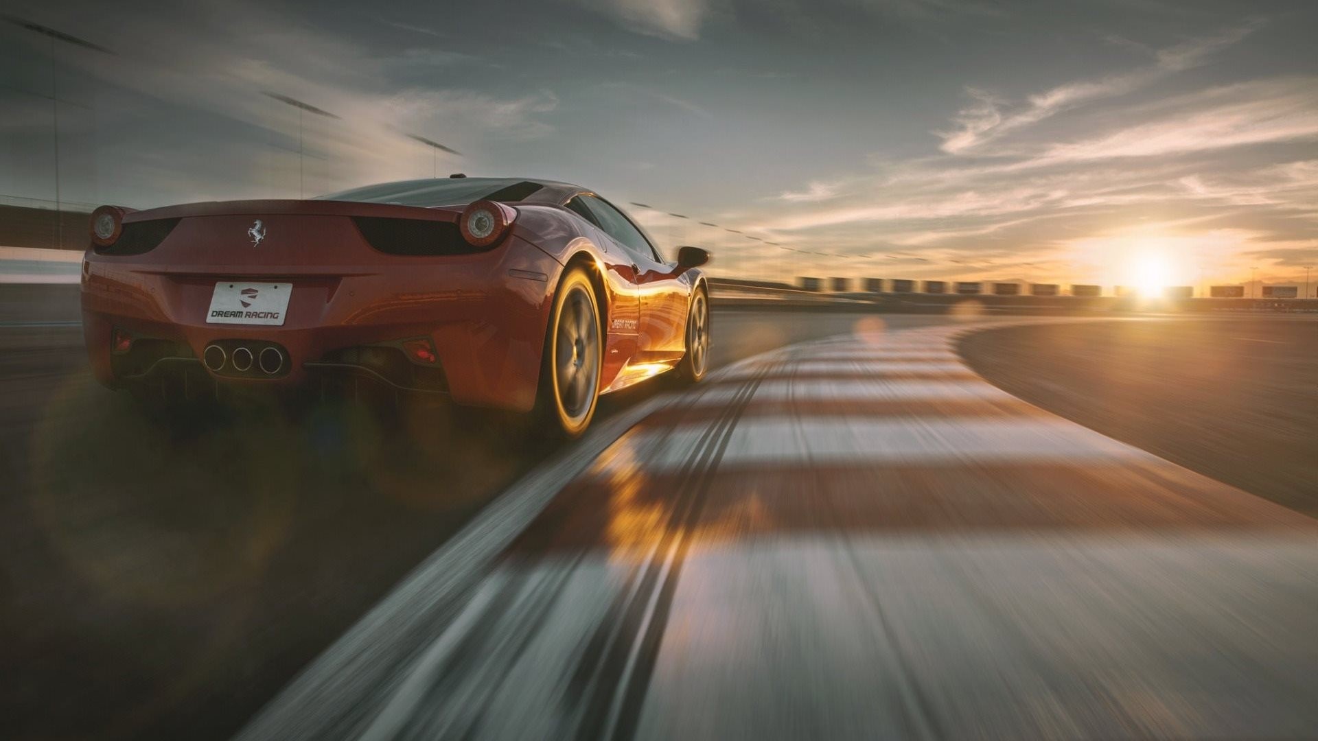 Red Ferrari 458 Italia on a race track at sunset HD Wallpaper