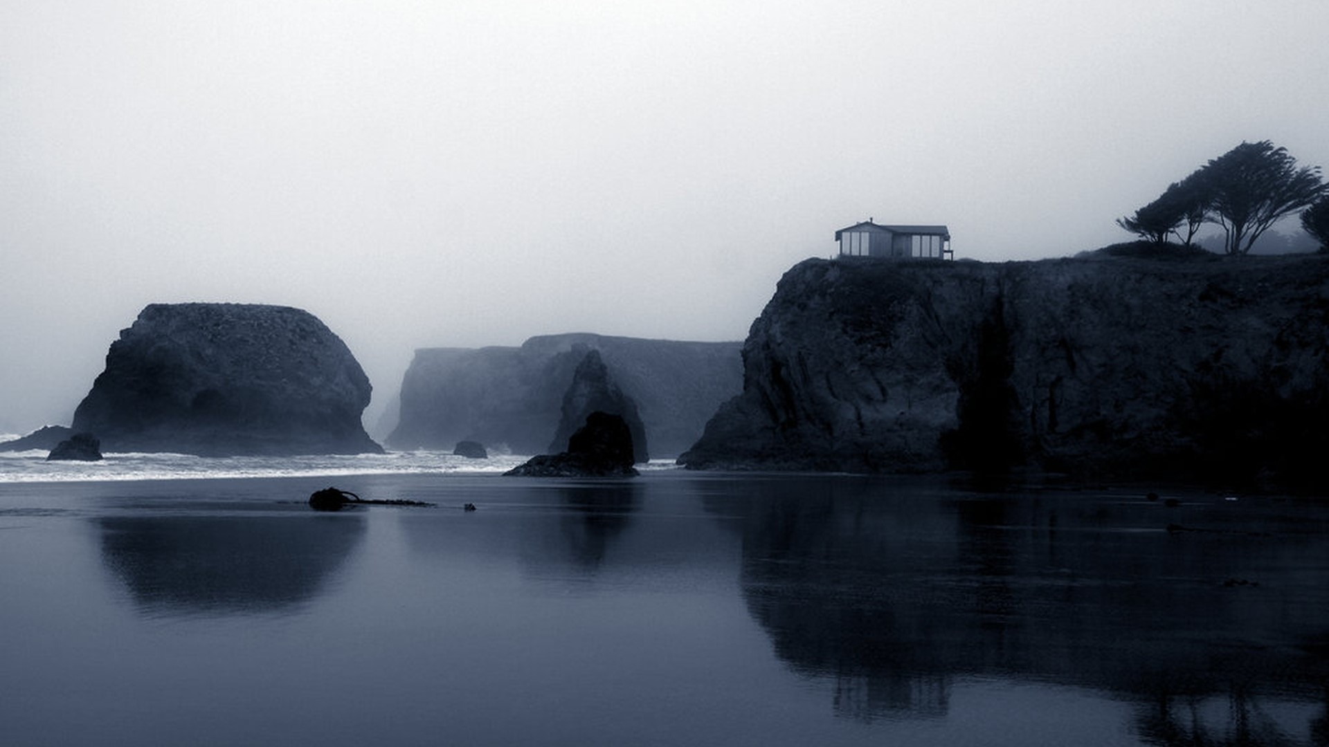 Foggy coastal landscape with a house on a cliff HD Wallpaper