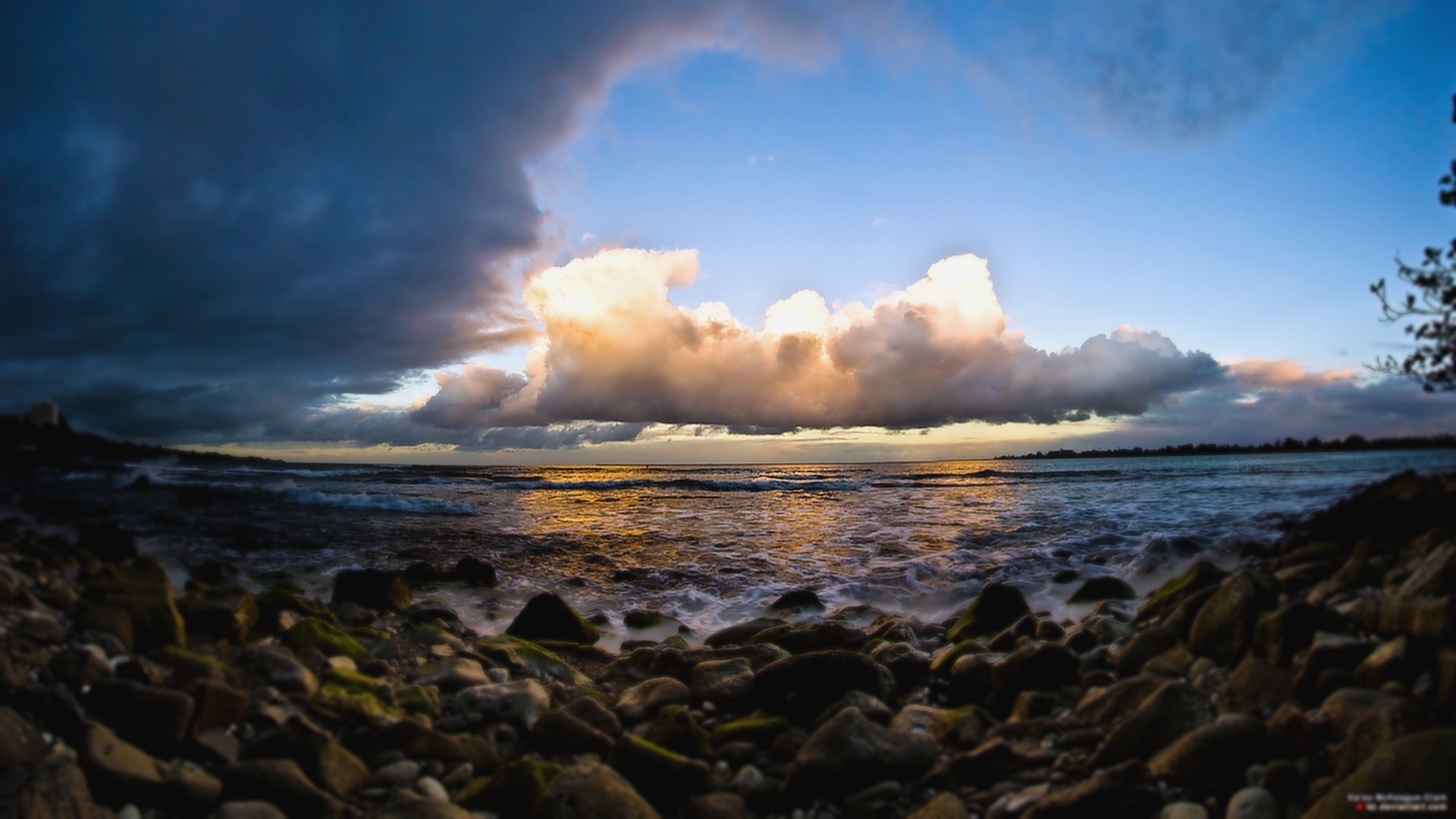 Stormy Clouds Over Rocky Shoreline at Sunset HD Wallpaper
