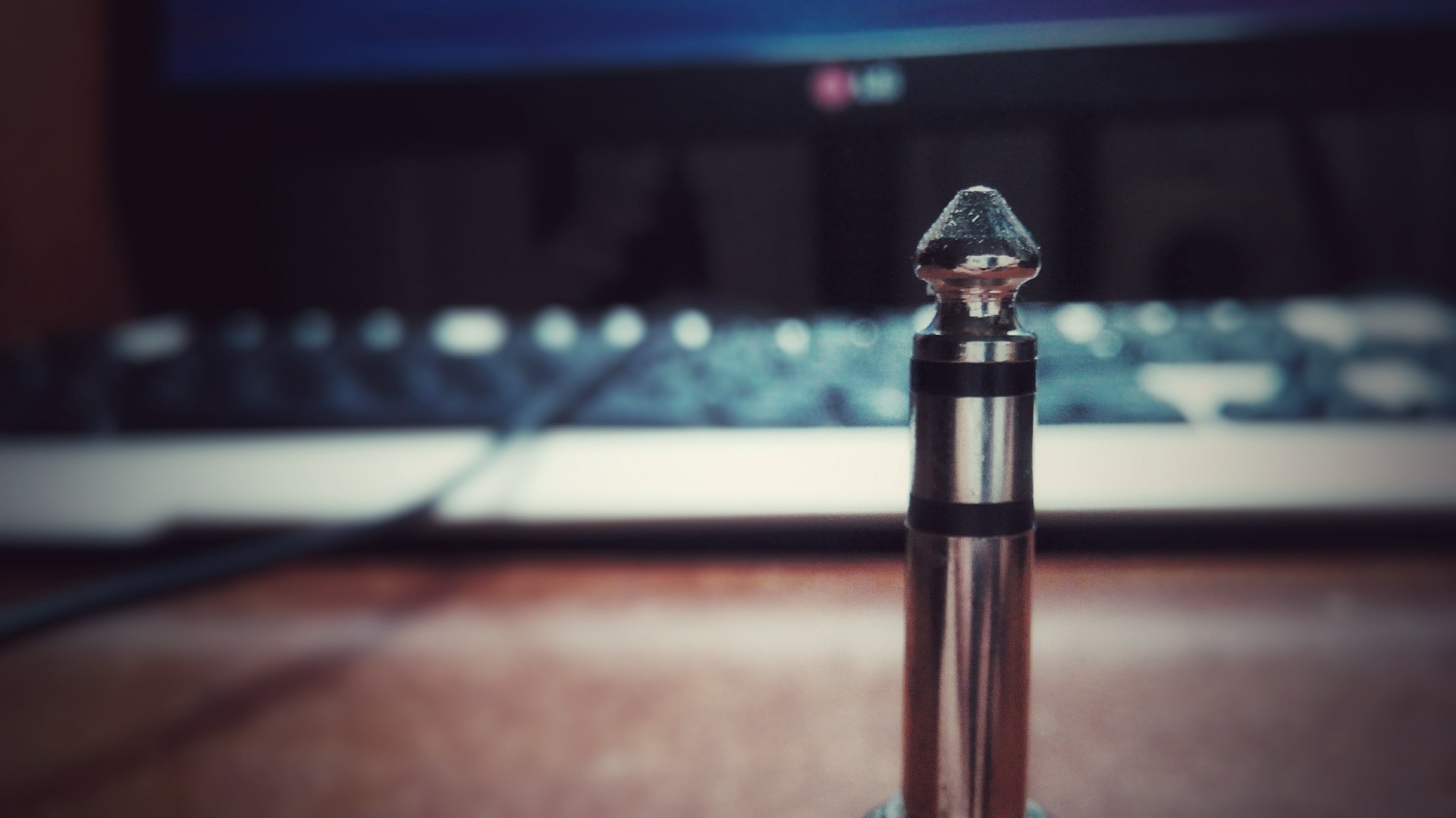 Close-up of a metal audio jack plug HD Wallpaper