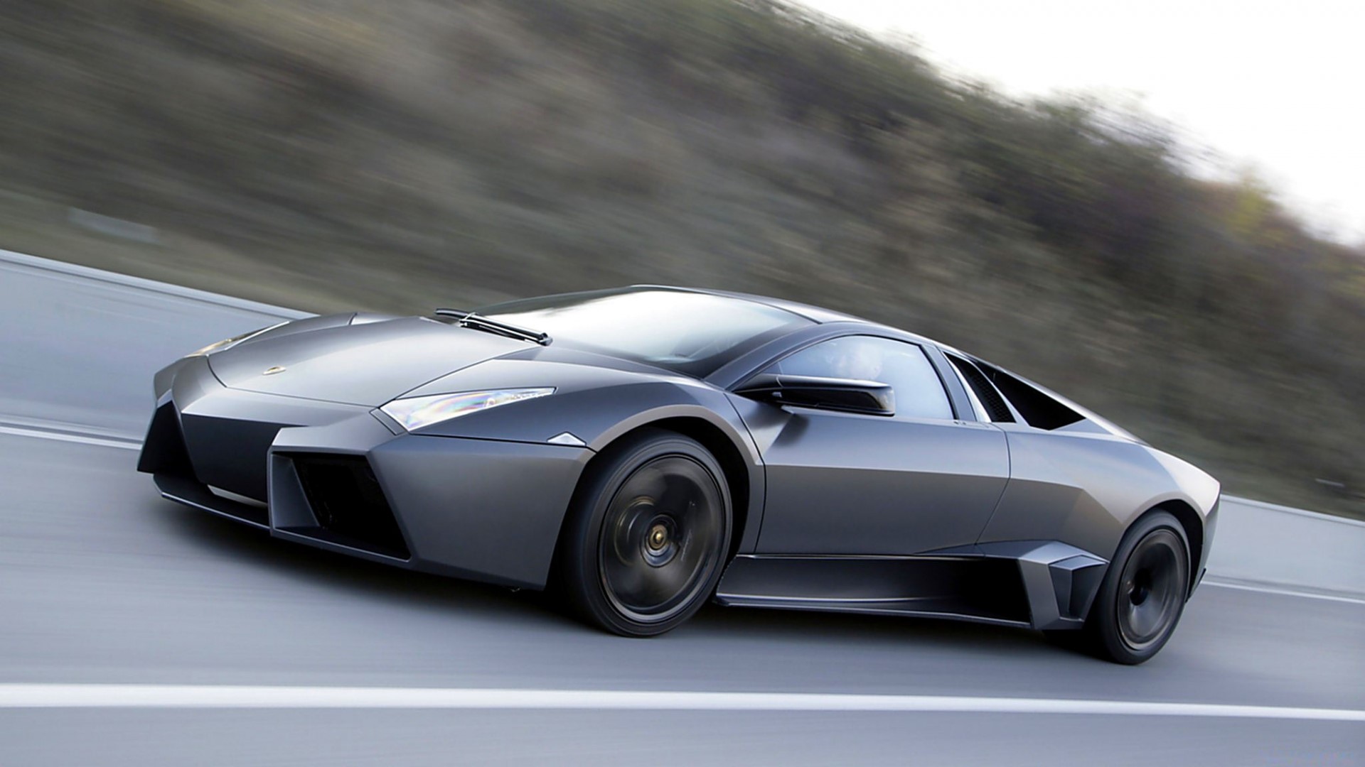 Lamborghini Reventon driving on a road HD Wallpaper