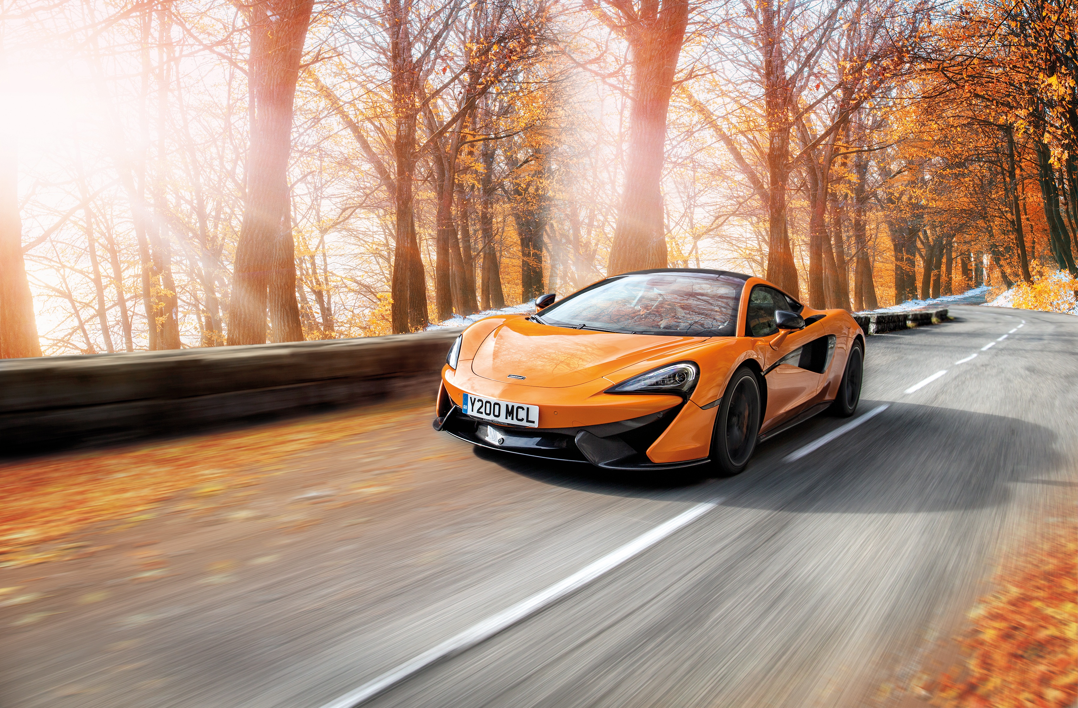 McLaren 570S with Pirelli Winter Tires on Autumn Road HD Wallpaper