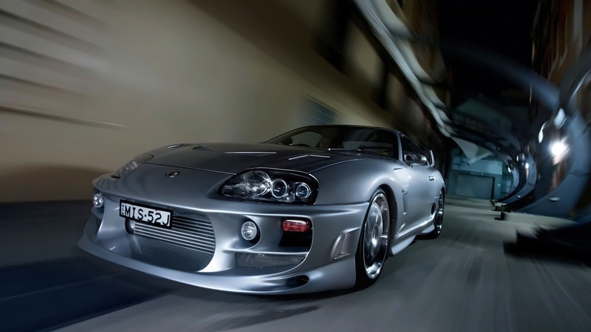 Silver Toyota Supra driving through a tunnel HD Wallpaper