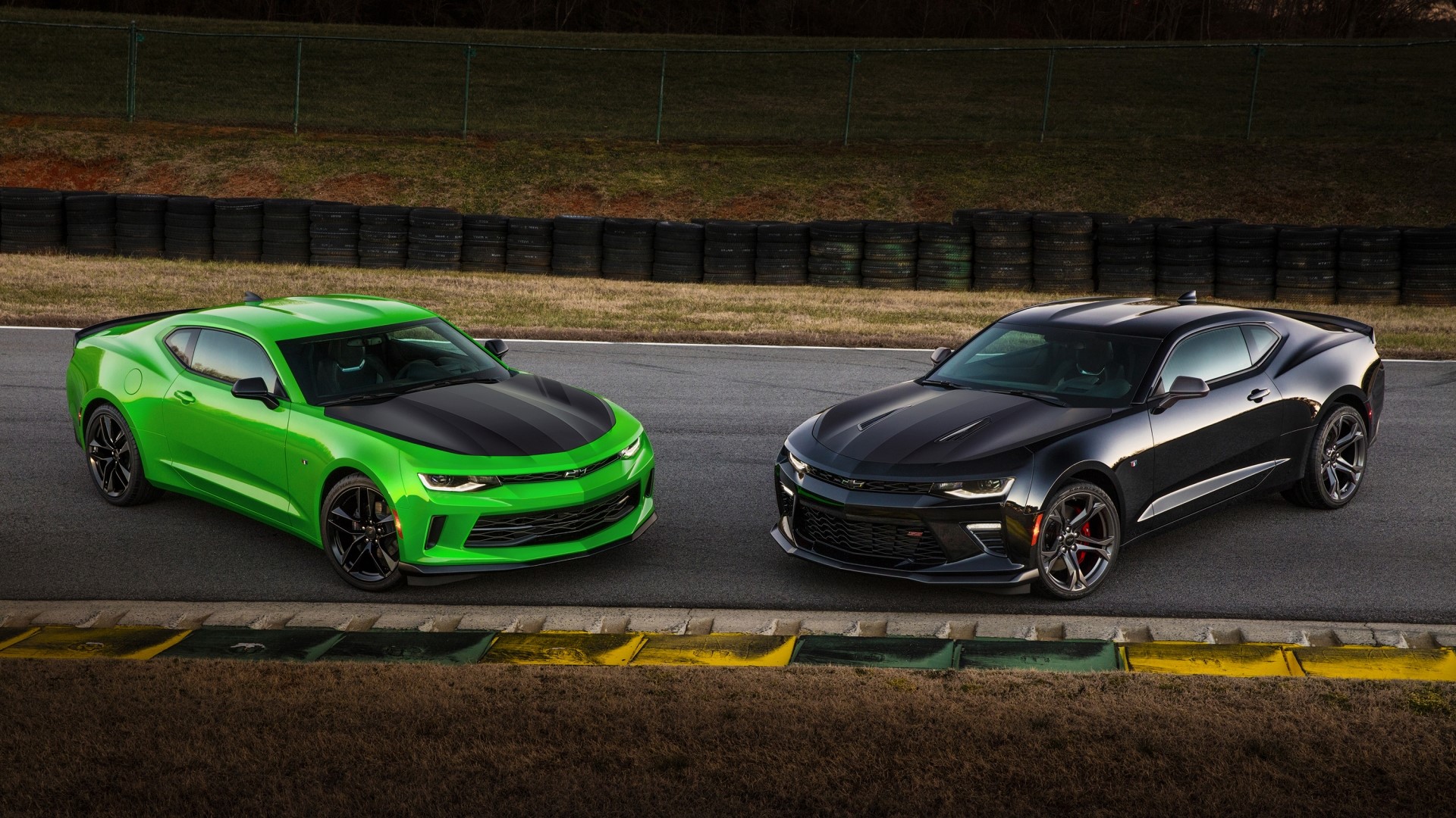 Two Chevrolet Camaros on a Racetrack HD Wallpaper