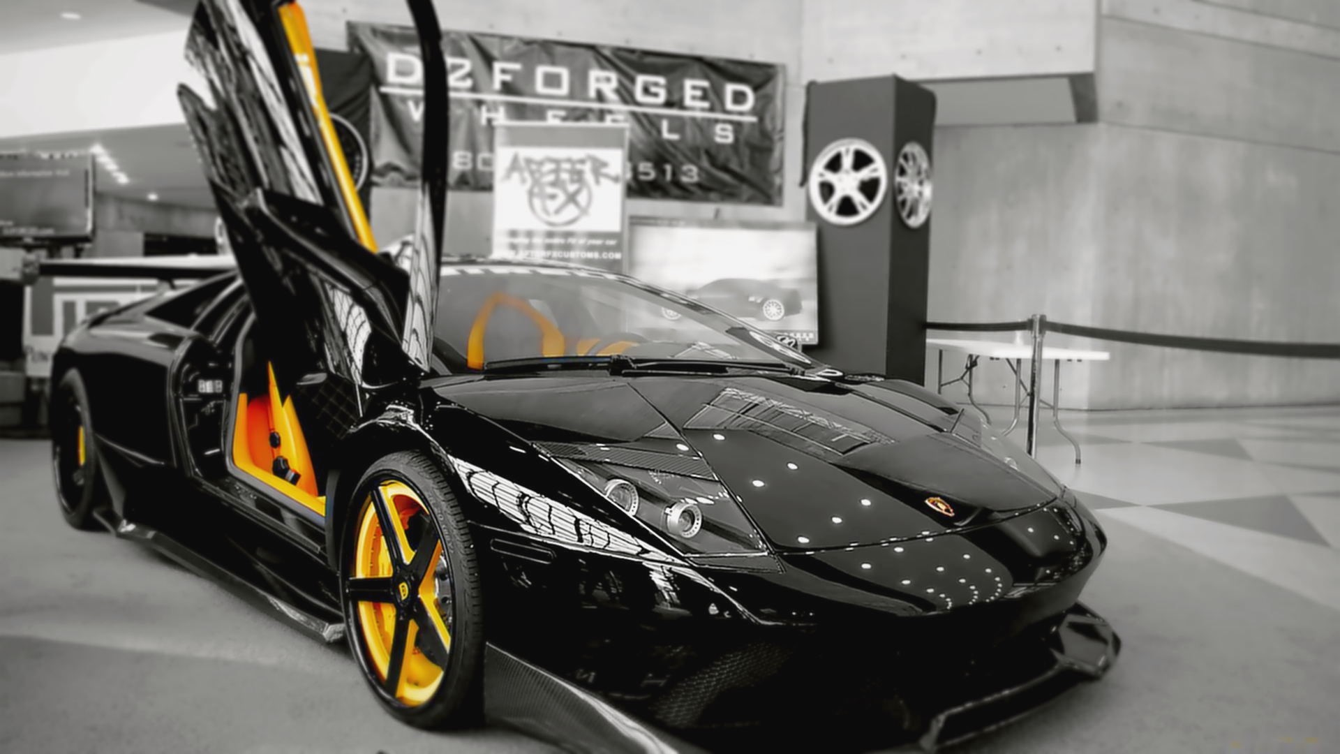 Black Lamborghini with yellow accents HD Wallpaper