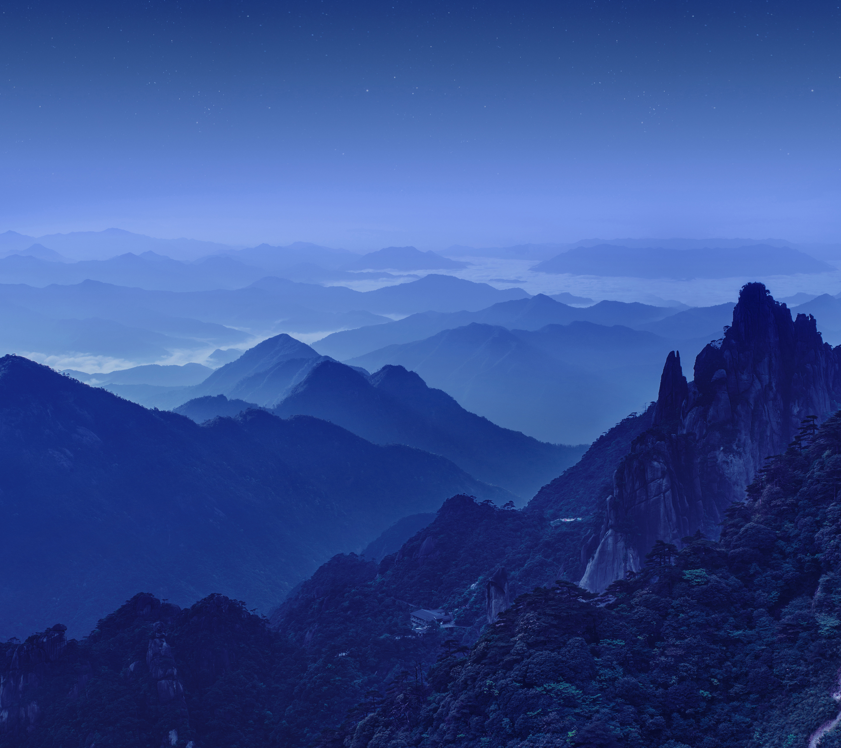 Mountain range at night with stars HD Wallpaper