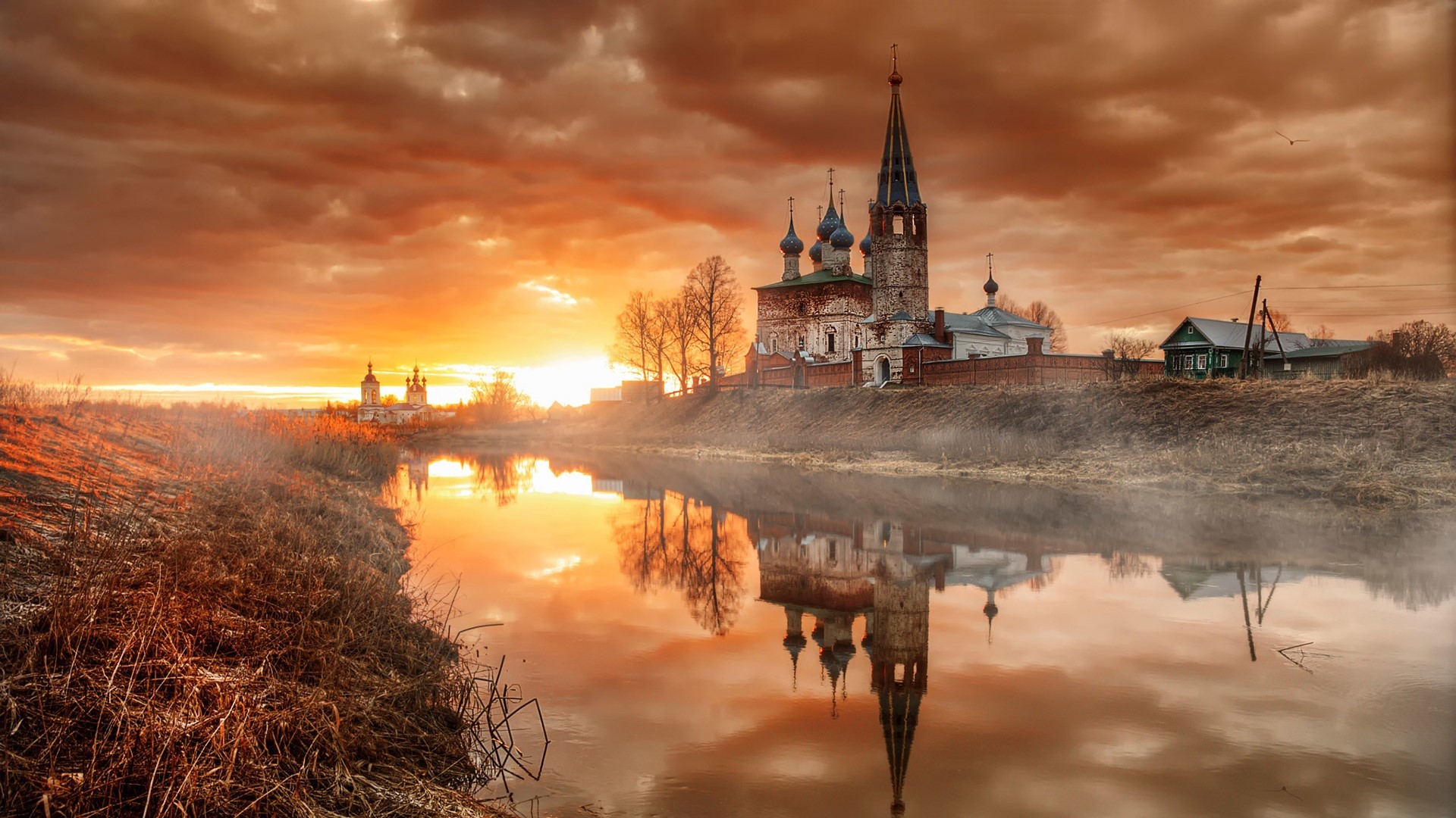 Church reflected in river at sunset, Dunilovo village HD Wallpaper