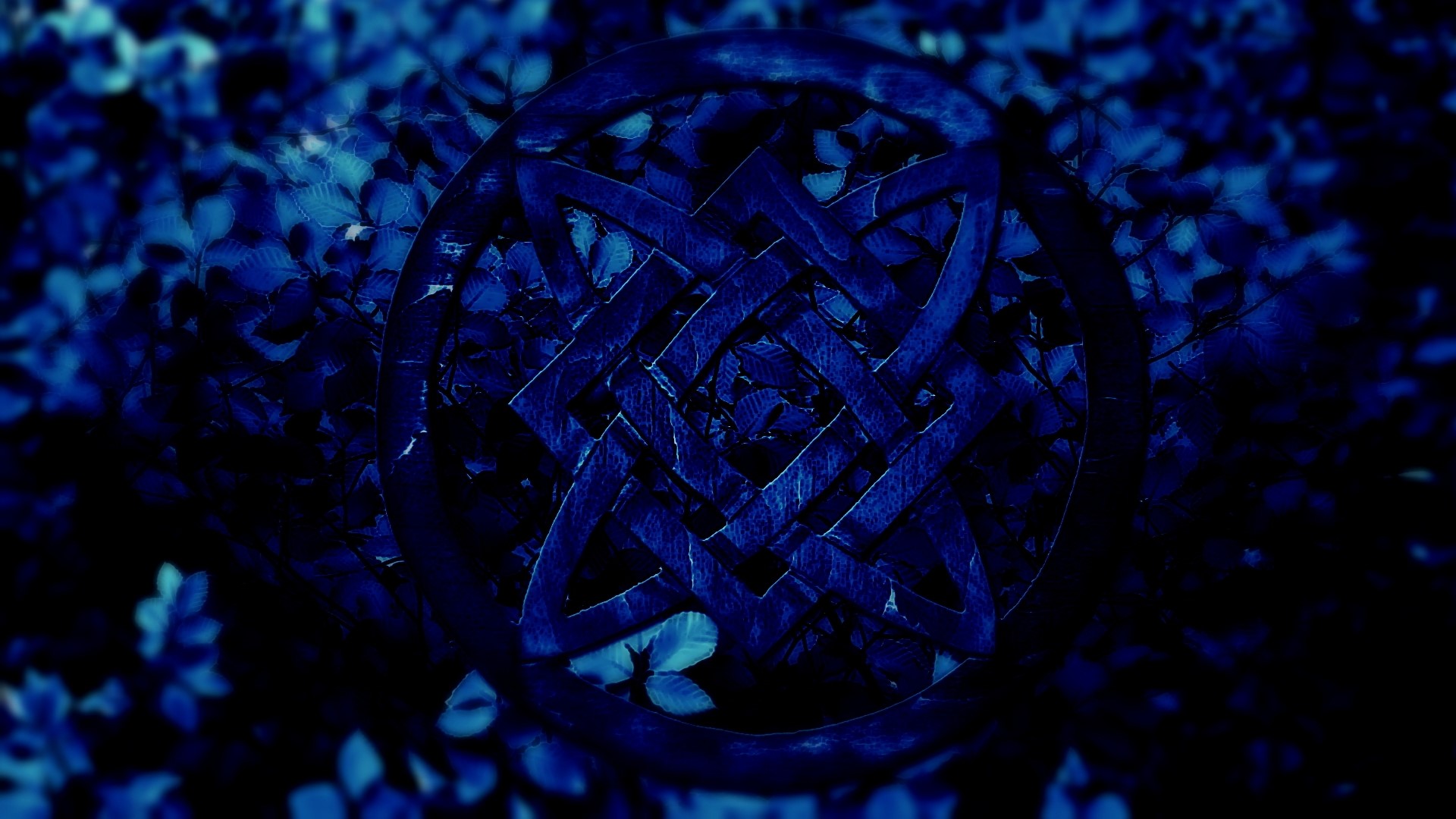 Blue Celtic Knot Symbol on Dark Foliage HD Wallpaper