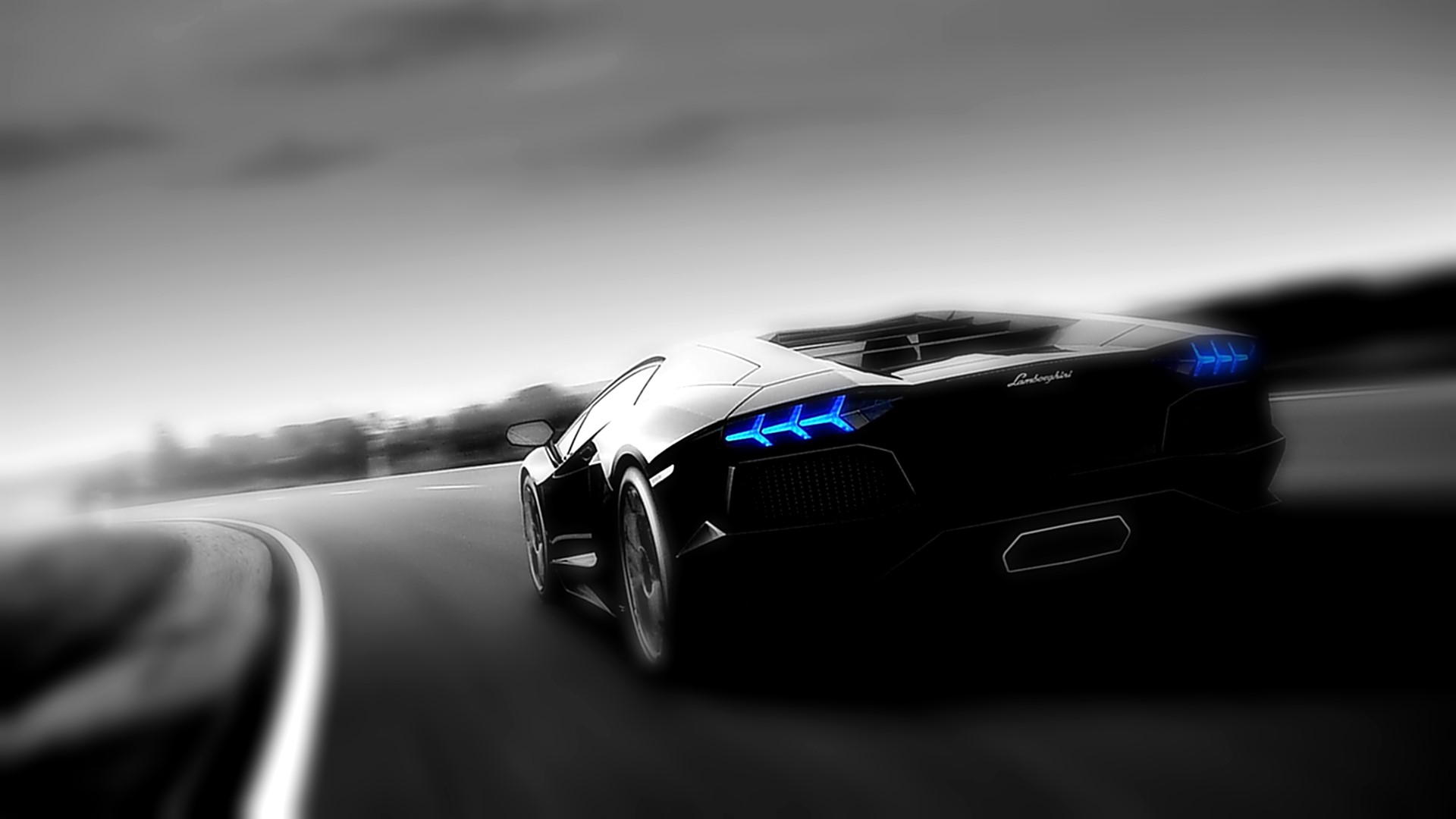 Black Lamborghini Aventador driving on a road HD Wallpaper