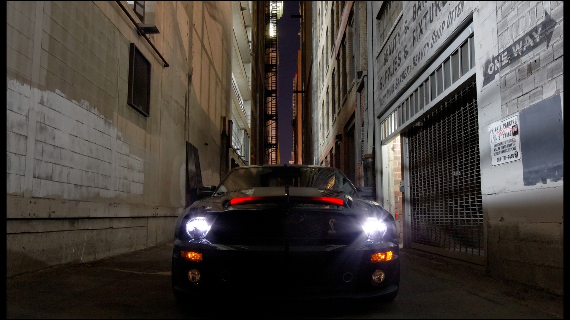 Black car in a dark alley at night HD Wallpaper