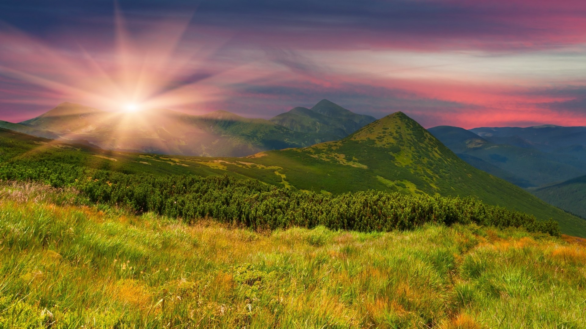Sunrise over green mountains with colorful sky HD Wallpaper
