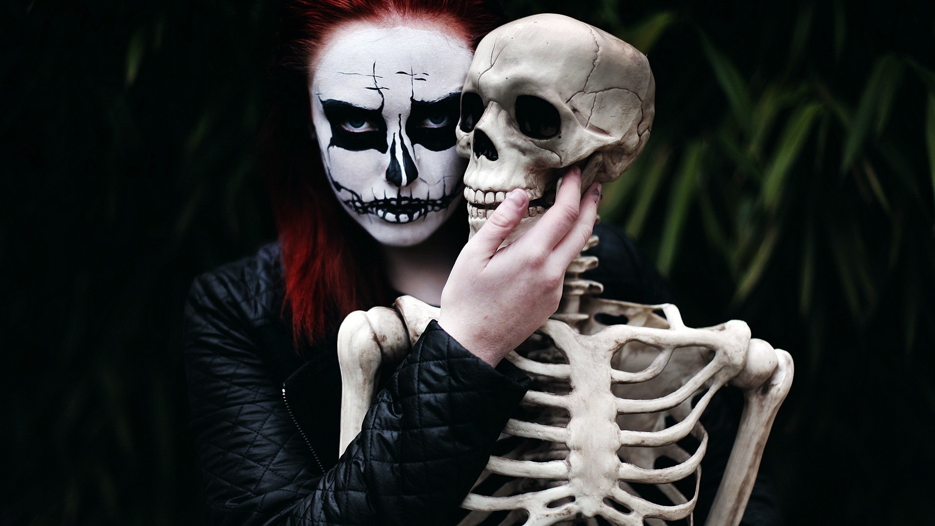 Person with skeleton makeup holding a skeleton HD Wallpaper