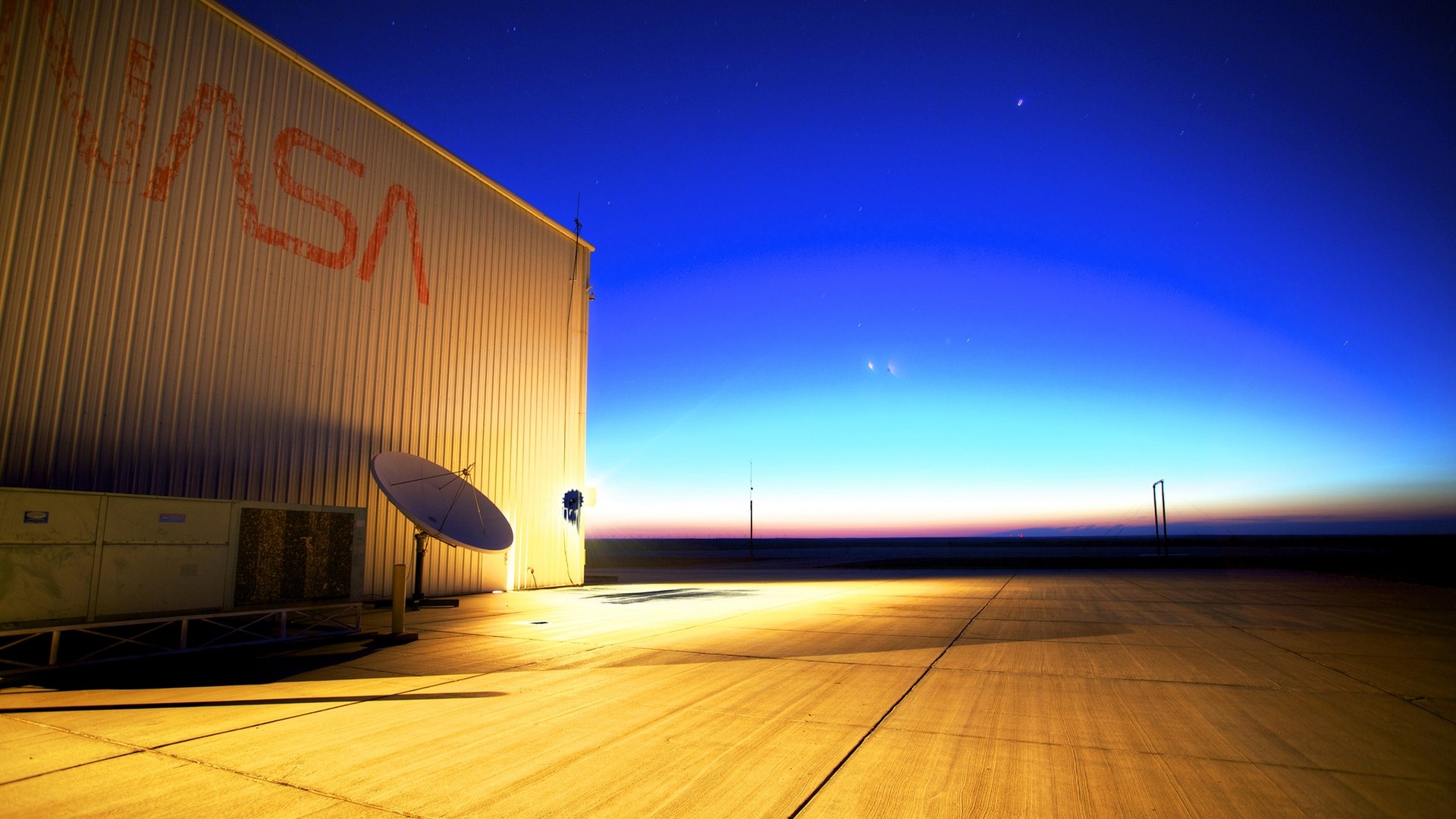 NASA Hangar at Dusk with Satellite Dish HD Wallpaper