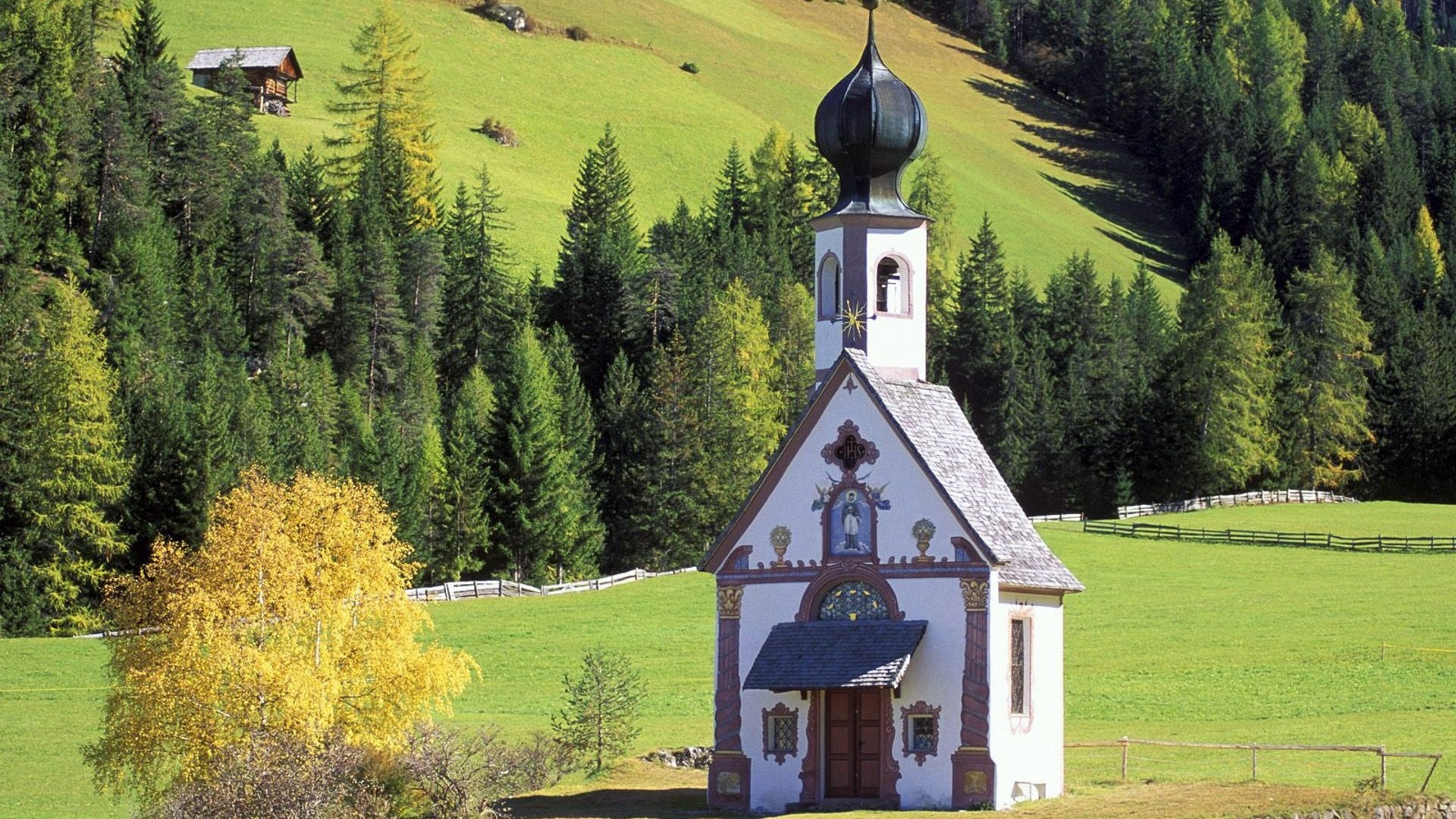 St. John's Church in a green mountain landscape HD Wallpaper