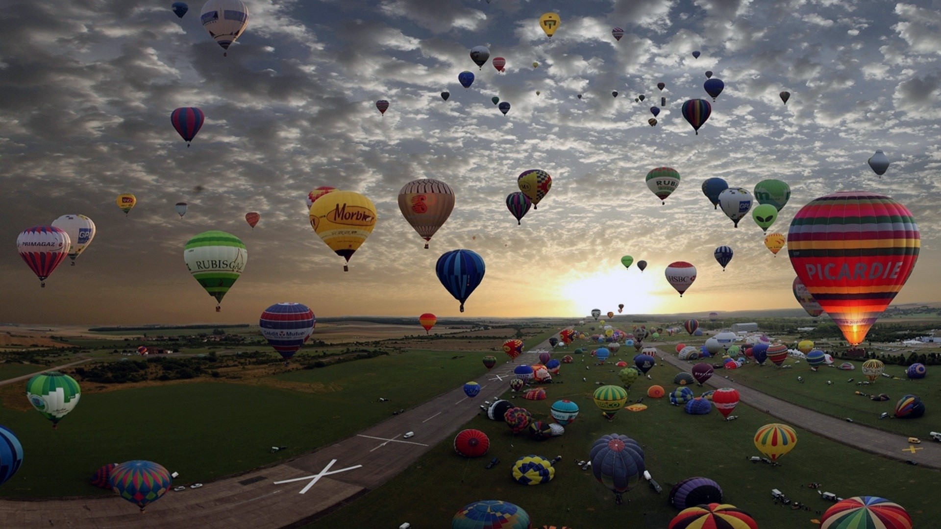 Mass Ascension of Hot Air Balloons at Sunrise HD Wallpaper