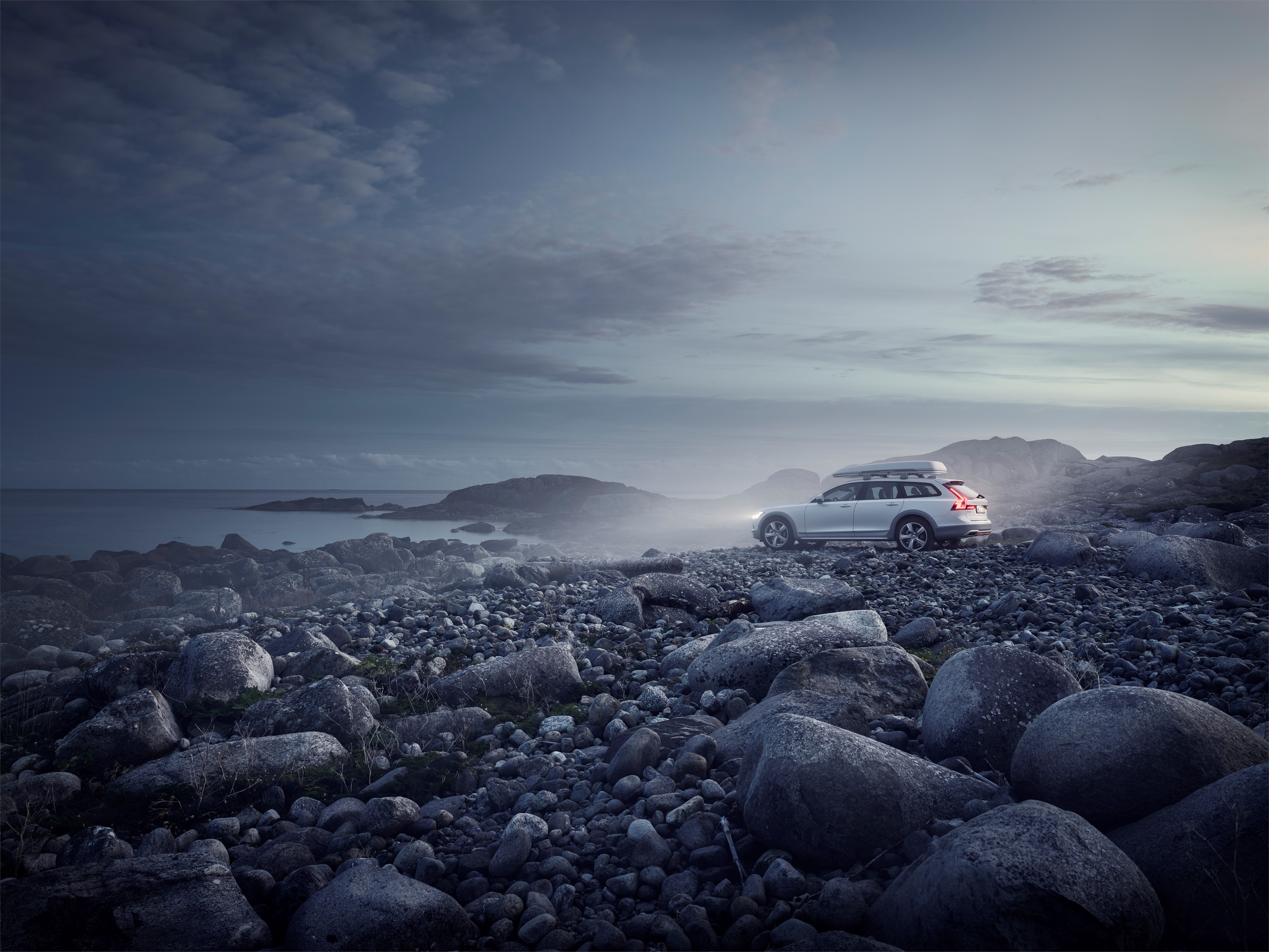 Volvo V90 Cross Country on rocky shore HD Wallpaper