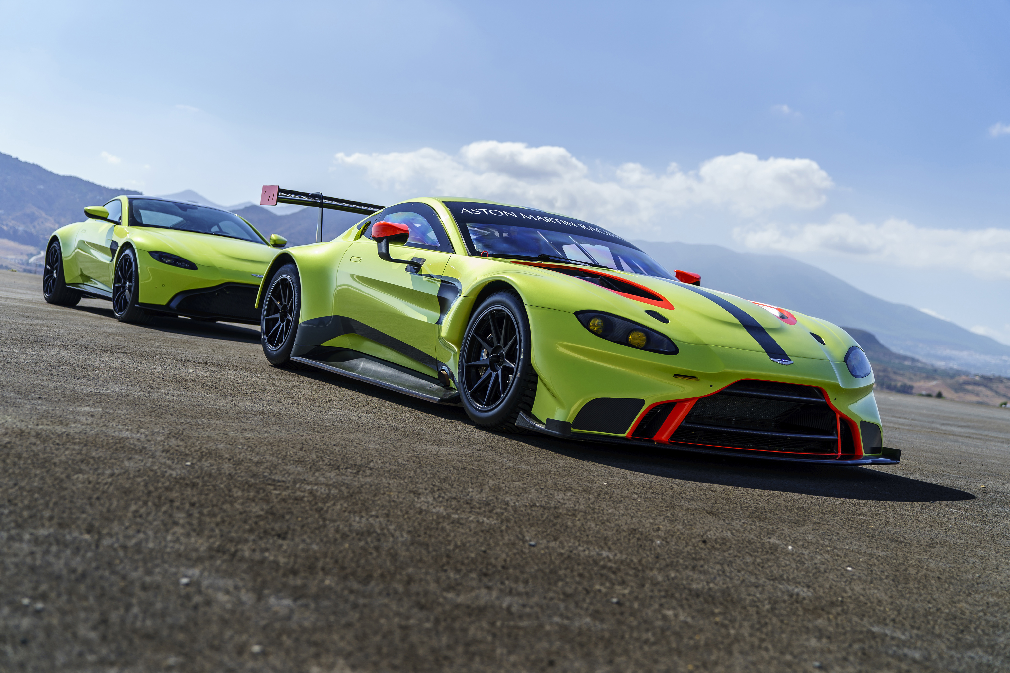 Aston Martin Vantage GTE race cars on a track HD Wallpaper
