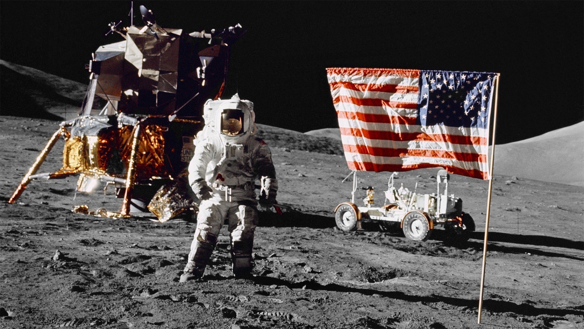 Astronaut on the Moon with Lunar Module and Flag HD Wallpaper
